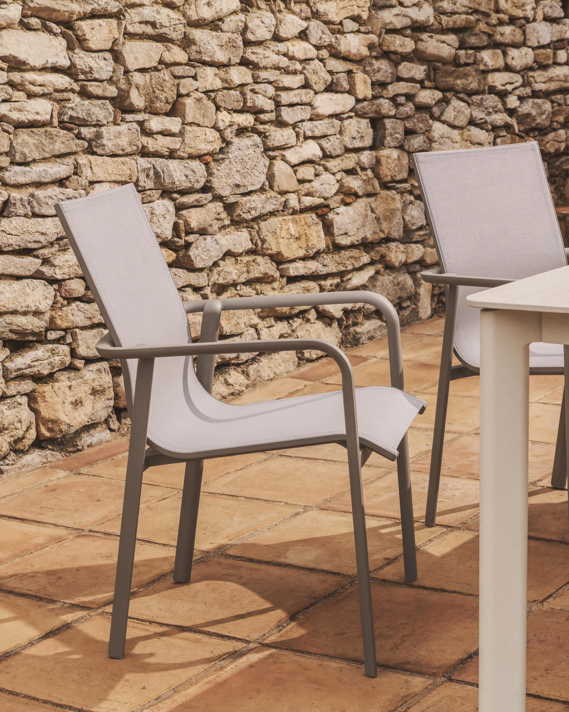 Canea stackable outdoor chair in beige texteline and taupe aluminium
