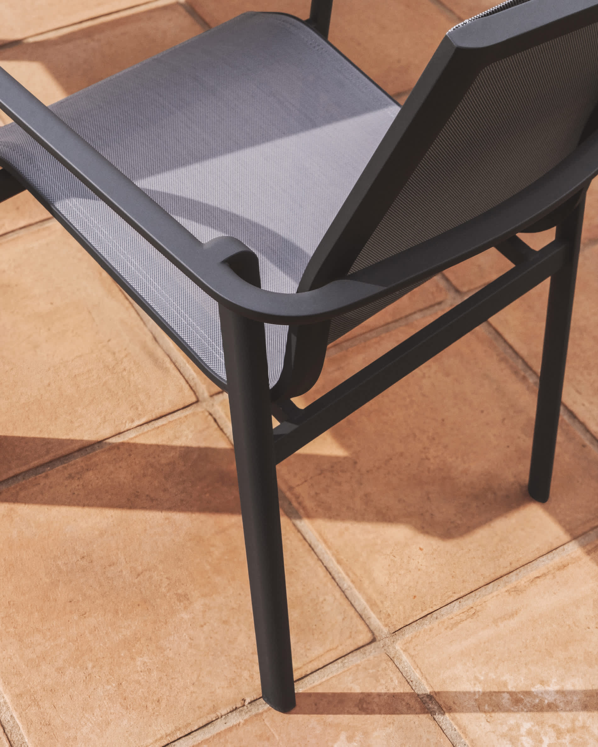Canea stackable outdoor chair in grey texteline and graphite aluminium