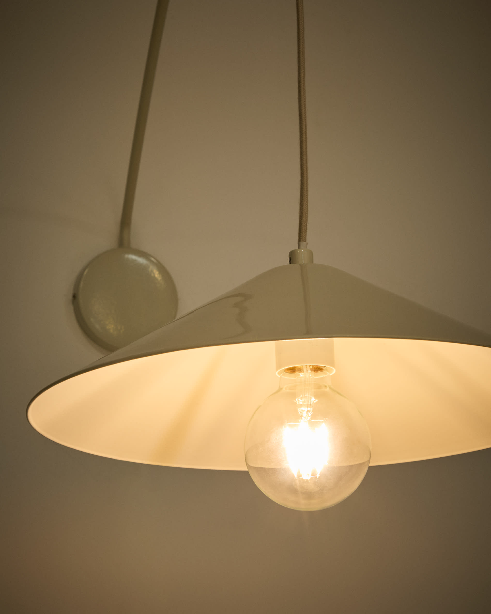 Kally wall lamp in a beige painted finish