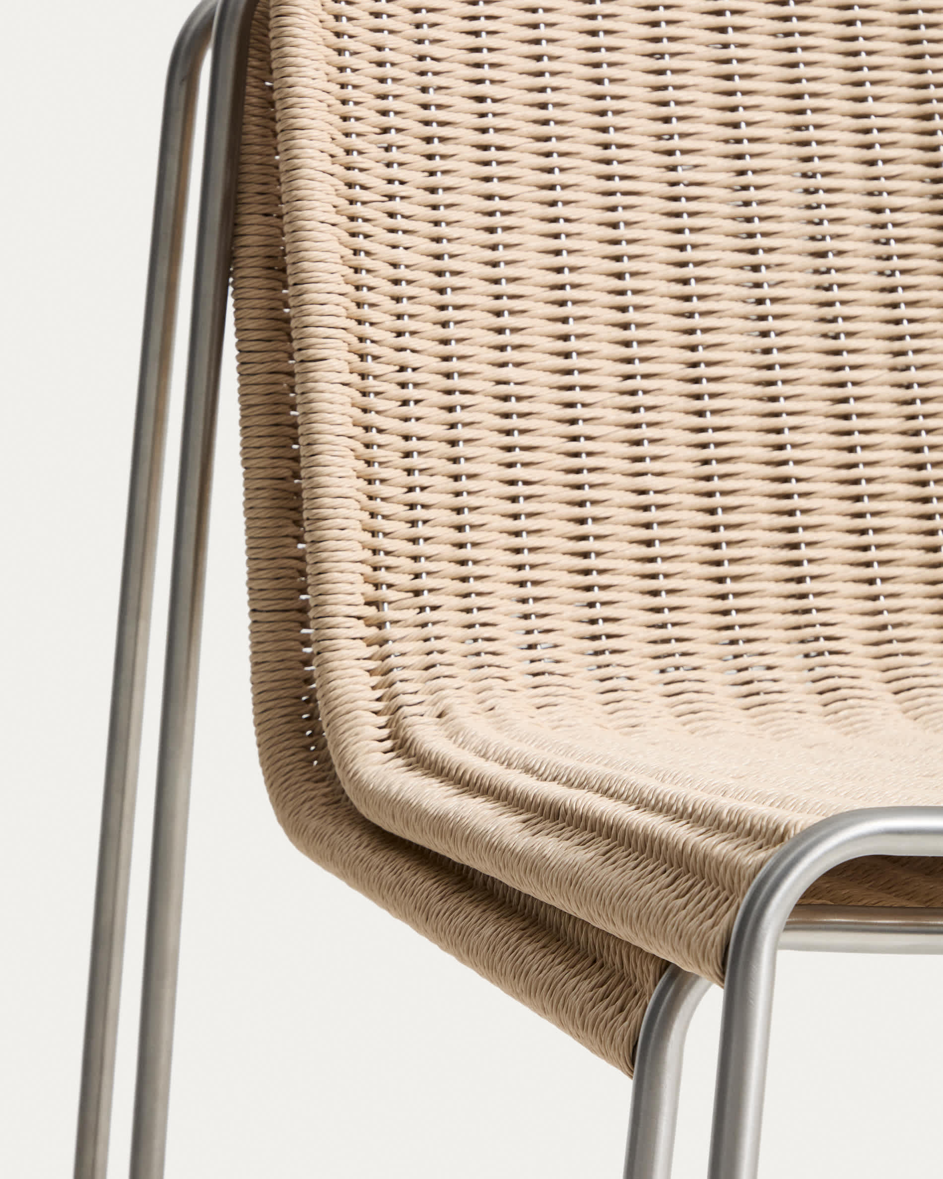 Tavari stackable chair in beige synthetic rope cord and AISI 304 stainless steel with brushed finish