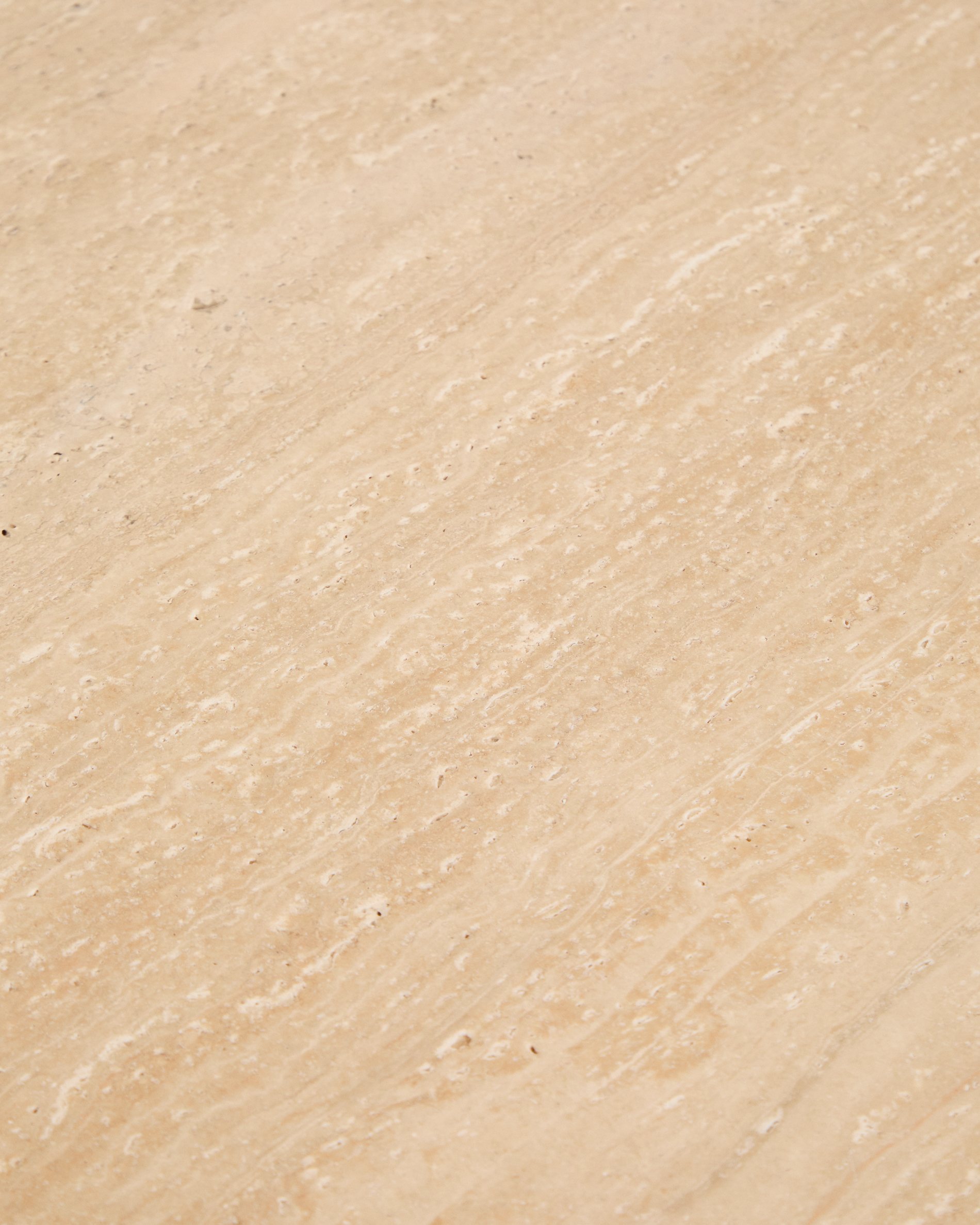 Pirita side table in beige travertine with solid oak wood legs with a dark finish 71 x 70cm FSC 100%
