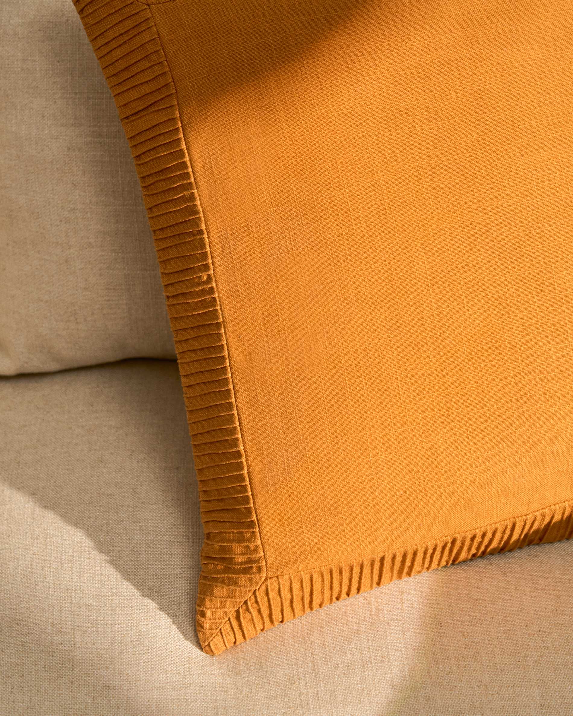 Luadia cotton cushion cover with orange pleated detail 50 x 50cm