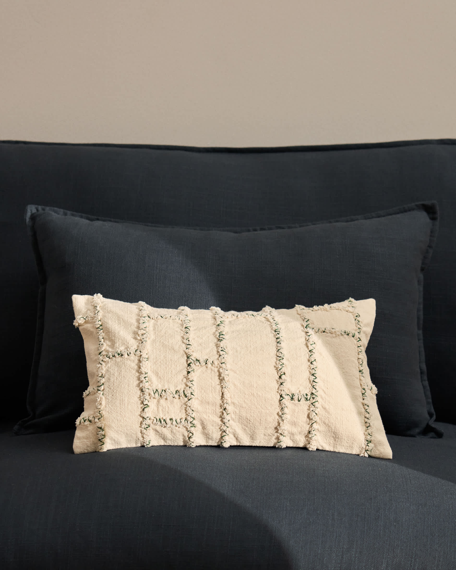 Verion green cushion cover with embroidered geometric detail 30 x 50cm