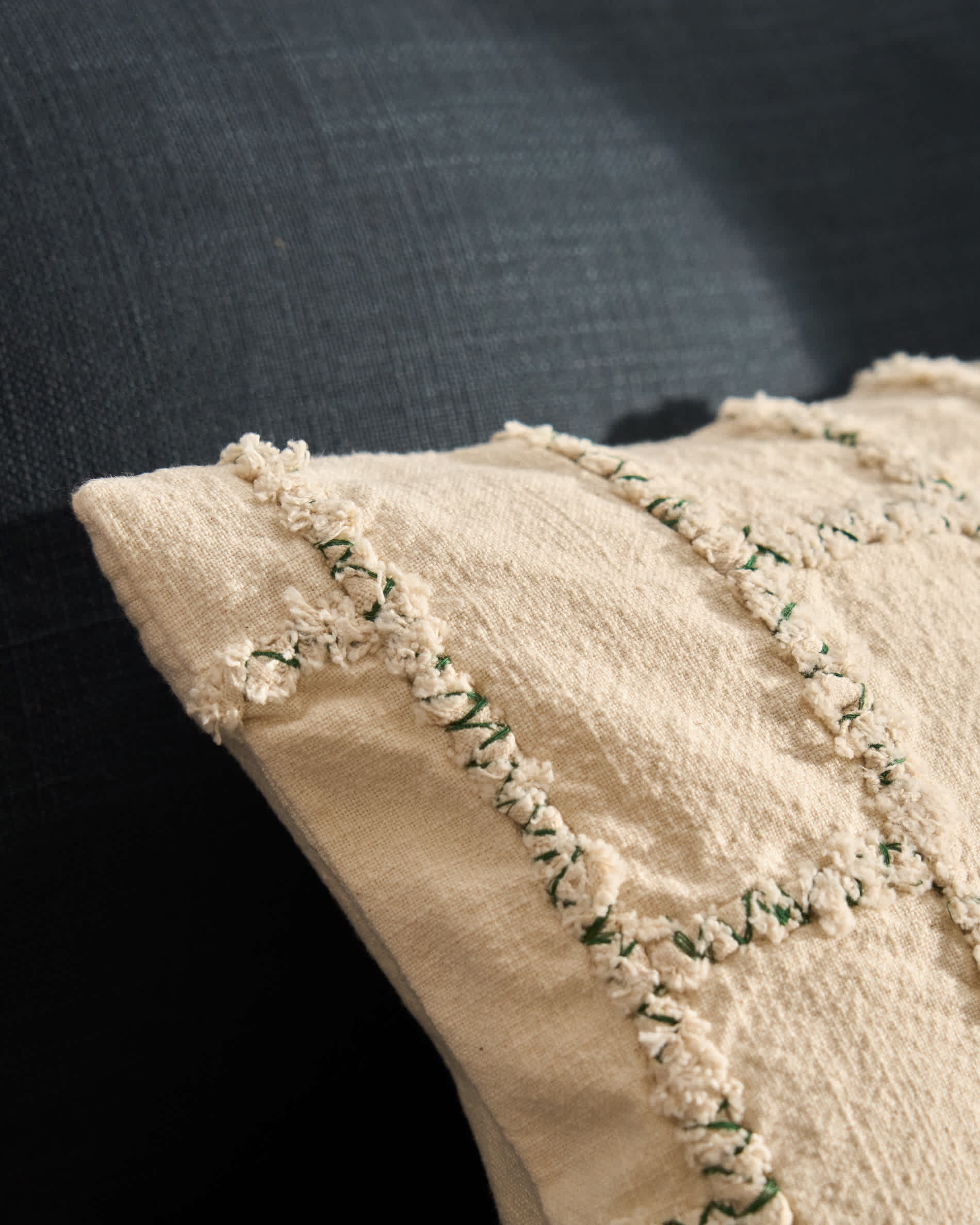 Verion green cushion cover with embroidered geometric detail 30 x 50cm