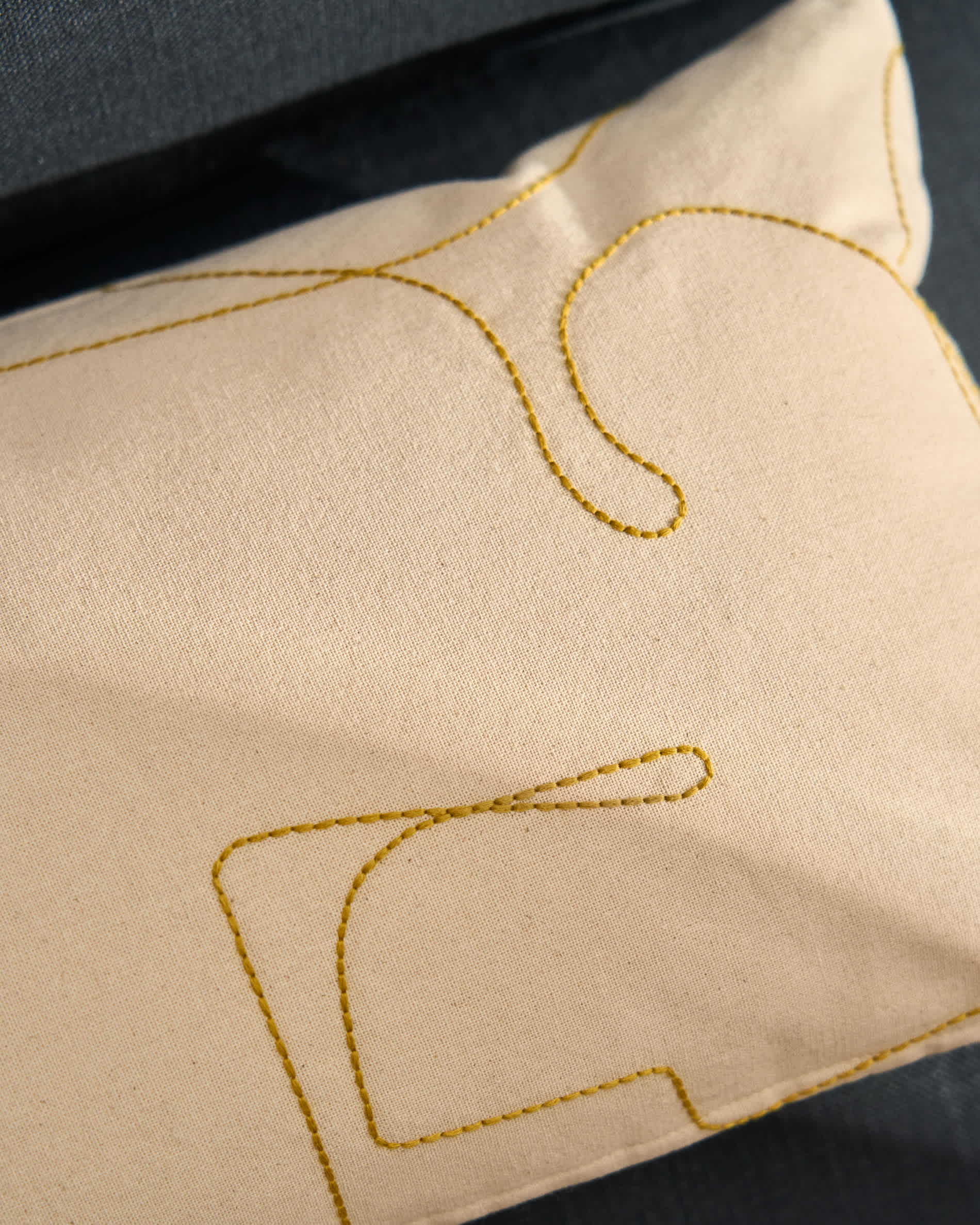 Dibel ecru cotton cushion cover with yellow embroidery detail 30 x 50cm
