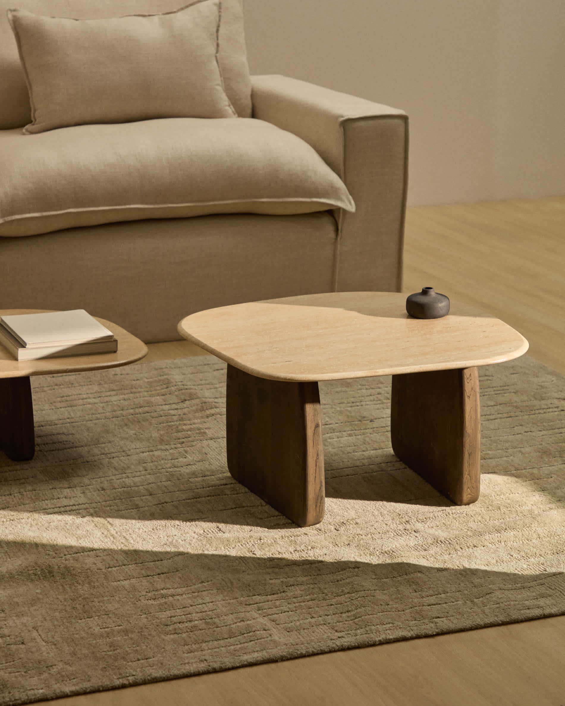 Pirita side table in beige travertine with solid oak wood legs with a dark finish 71 x 70cm FSC 100%