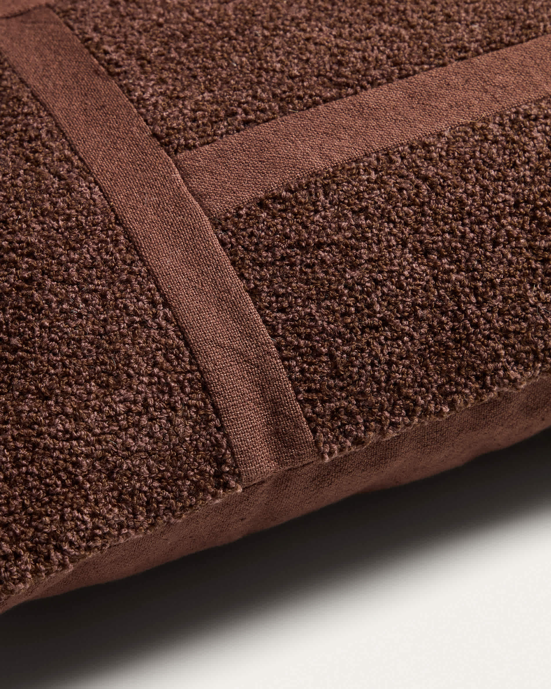 Lomel micro bouclé cushion cover with brown graphic detailing 40 x 60 cm
