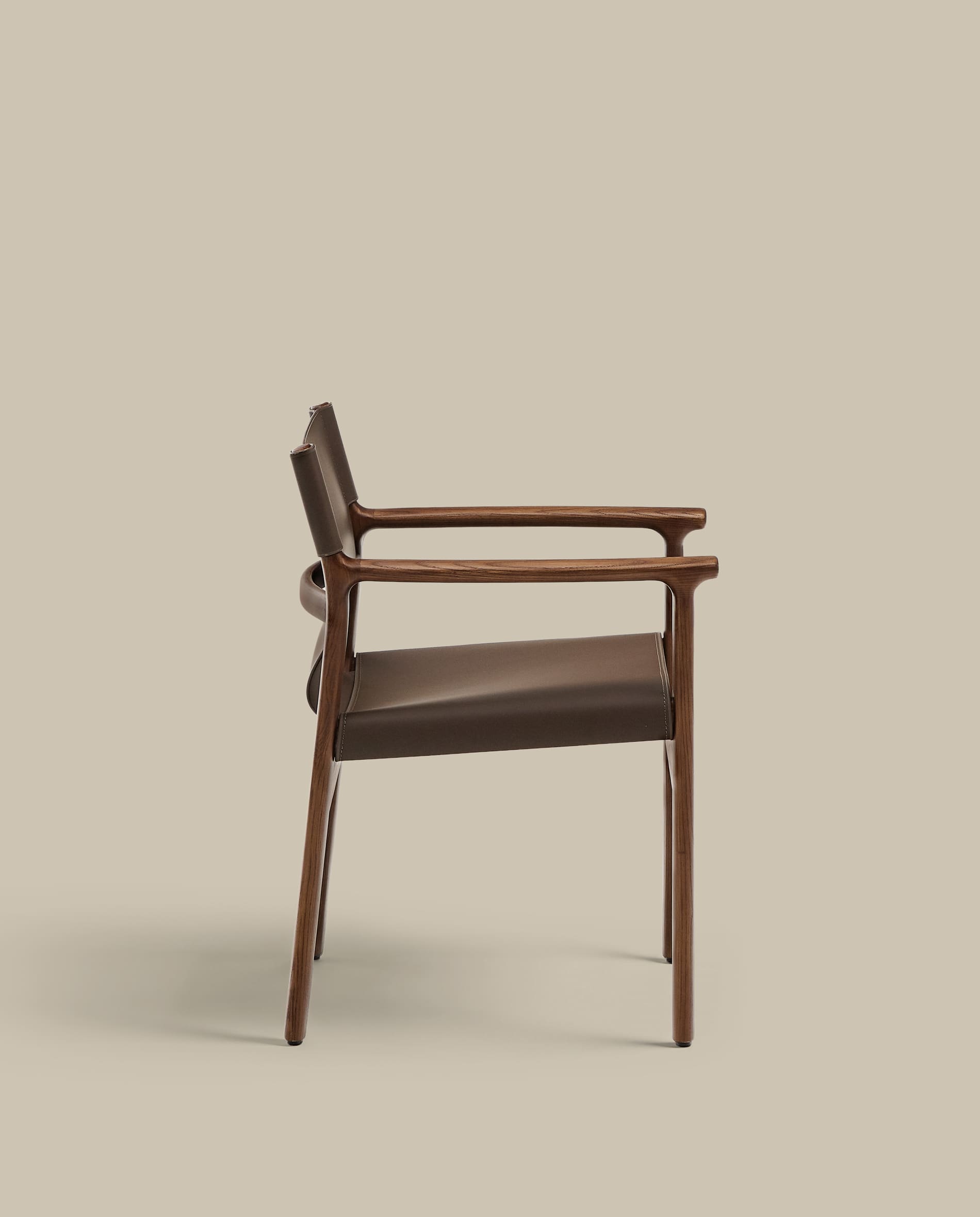 Jan chair made of dark brown recycled leather fibres and FSC 100% solid ash wood with walnut-coloured finish