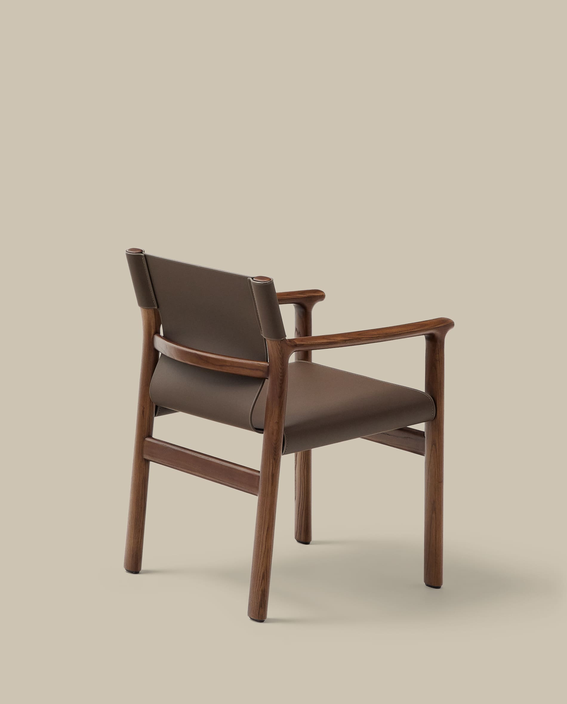 Jan chair made of dark brown recycled leather fibres and FSC 100% solid ash wood with walnut-coloured finish