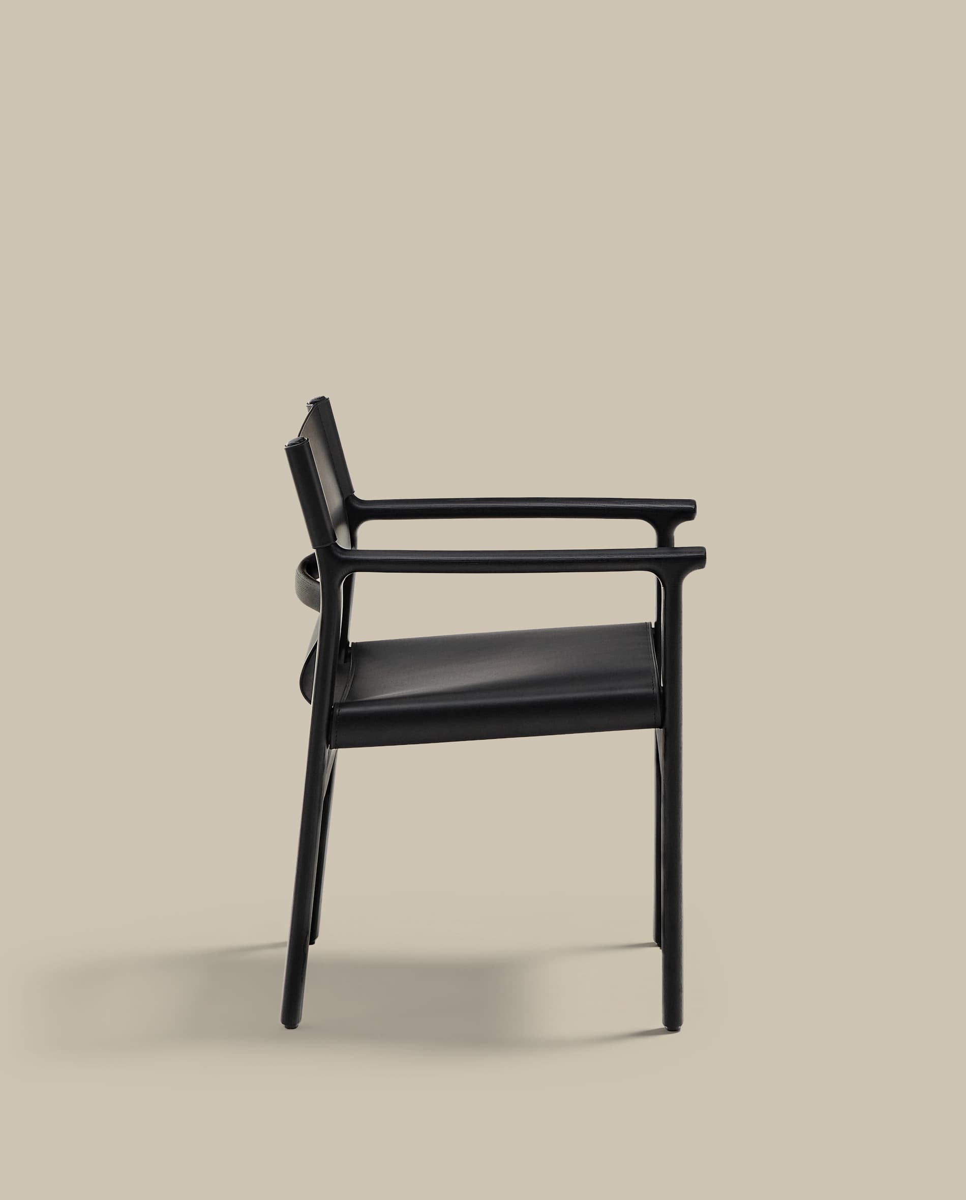 Jan chair made of black recycled leather fibres and FSC 100% solid ash wood with black finish