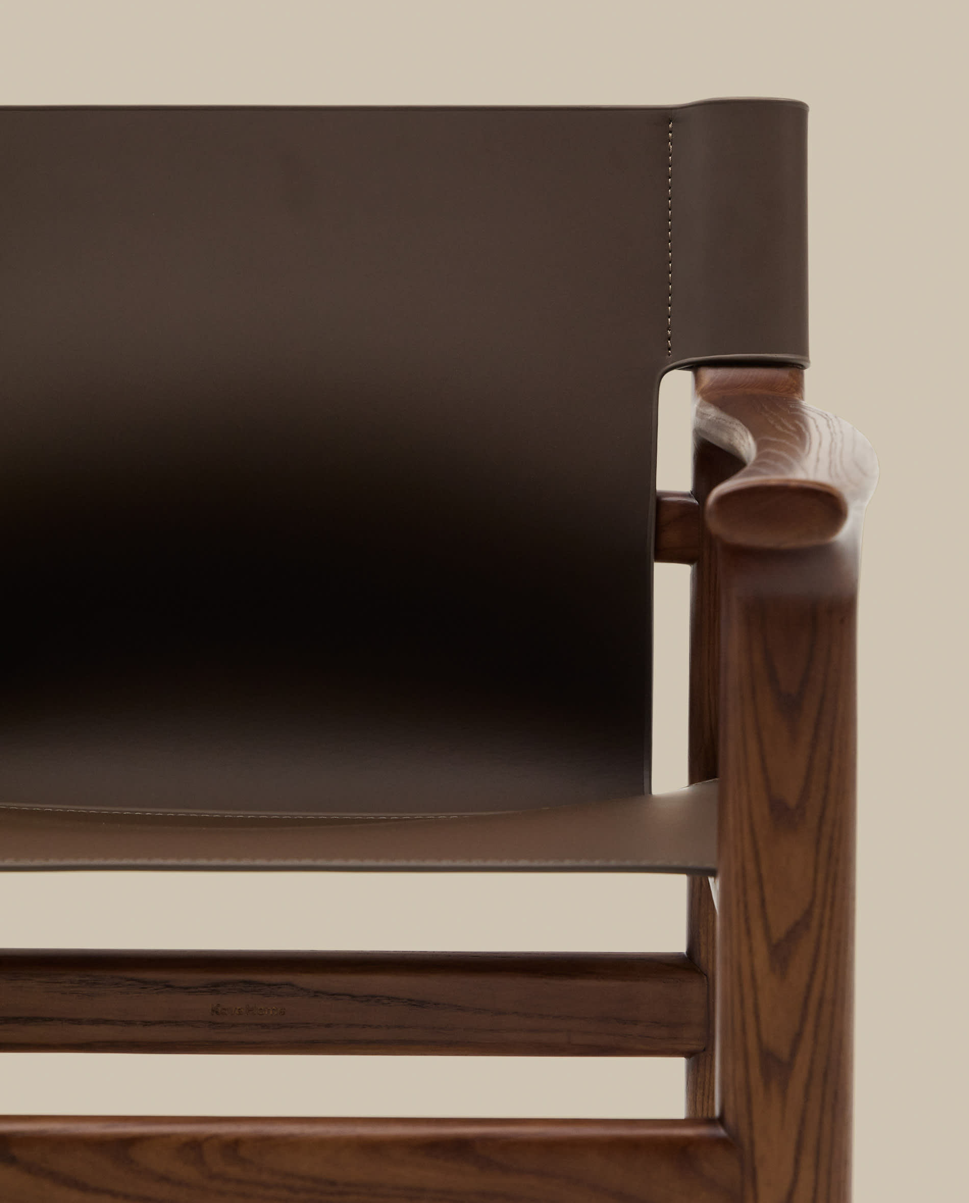 Jan chair made of dark brown recycled leather fibres and FSC 100% solid ash wood with walnut-coloured finish