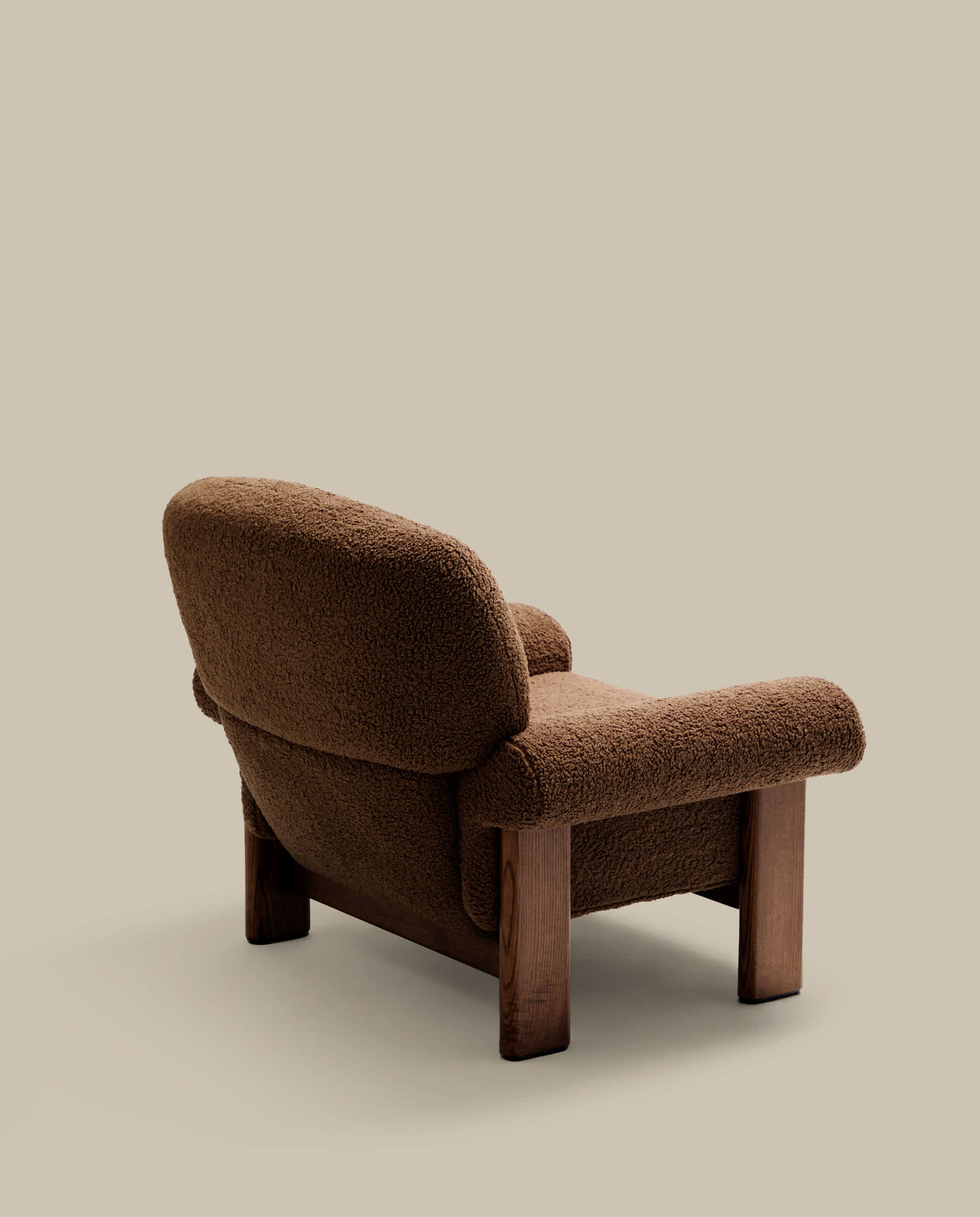 Nema armchair in taupe bouclé with solid ash wood legs in a walnut finish FSC 100%