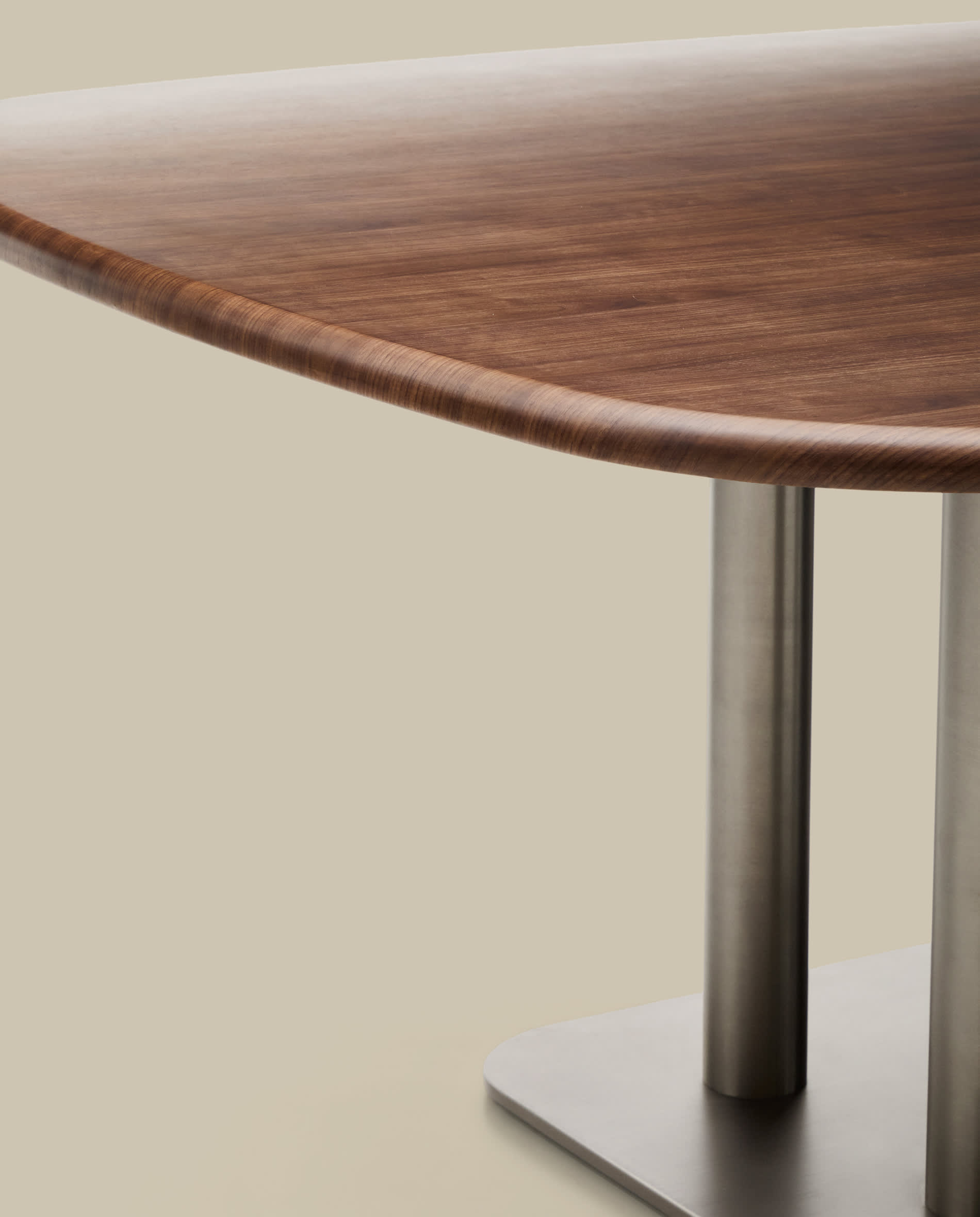 Melvar table made from walnut veneer and legs with brushed stainless steel base 150 x 150cm