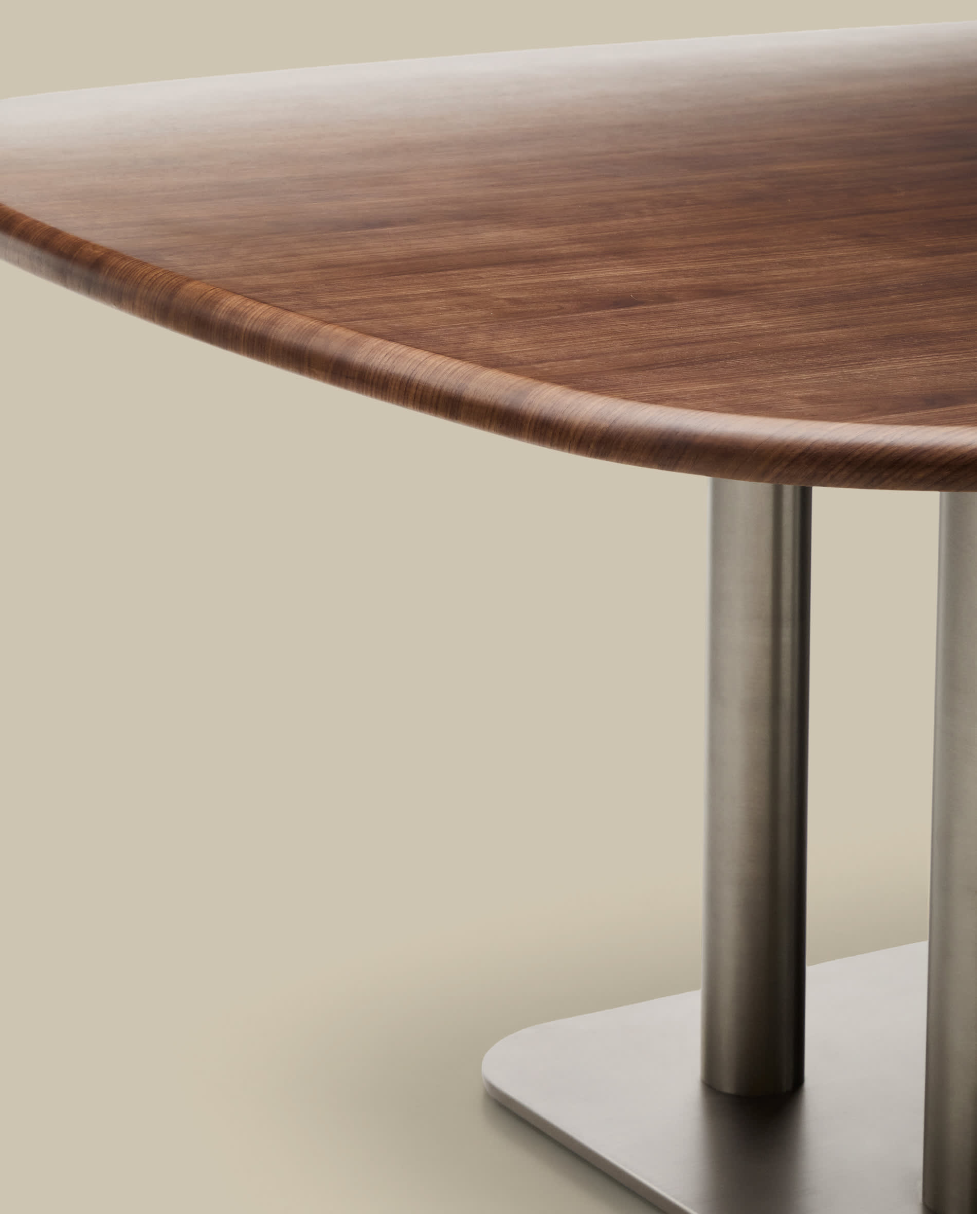 Melvar table made from walnut veneer and legs with brushed stainless steel base 121 x 121cm