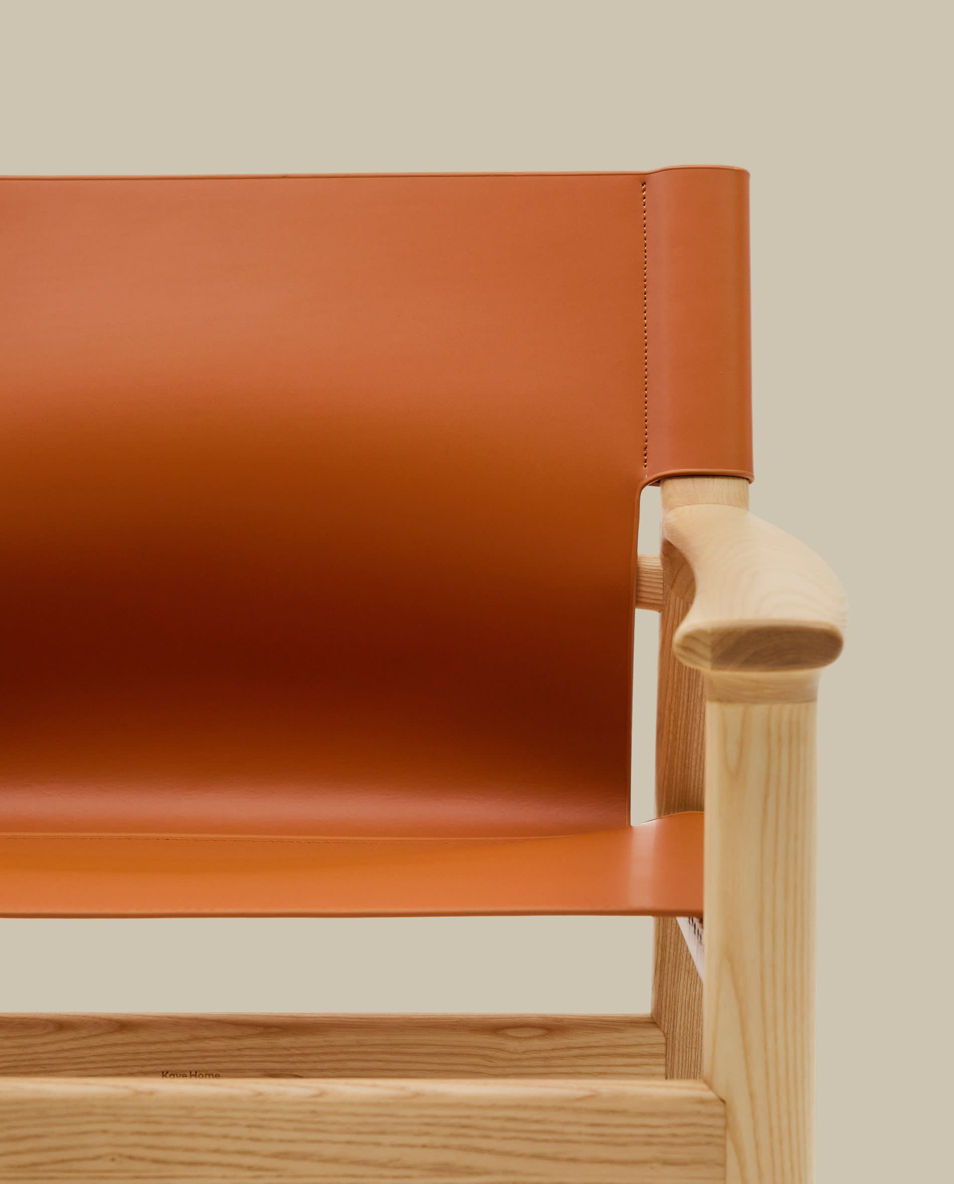 Jan armchair made of light brown recycled leather fibres and FSC 100% solid ash wood with natural tone finish