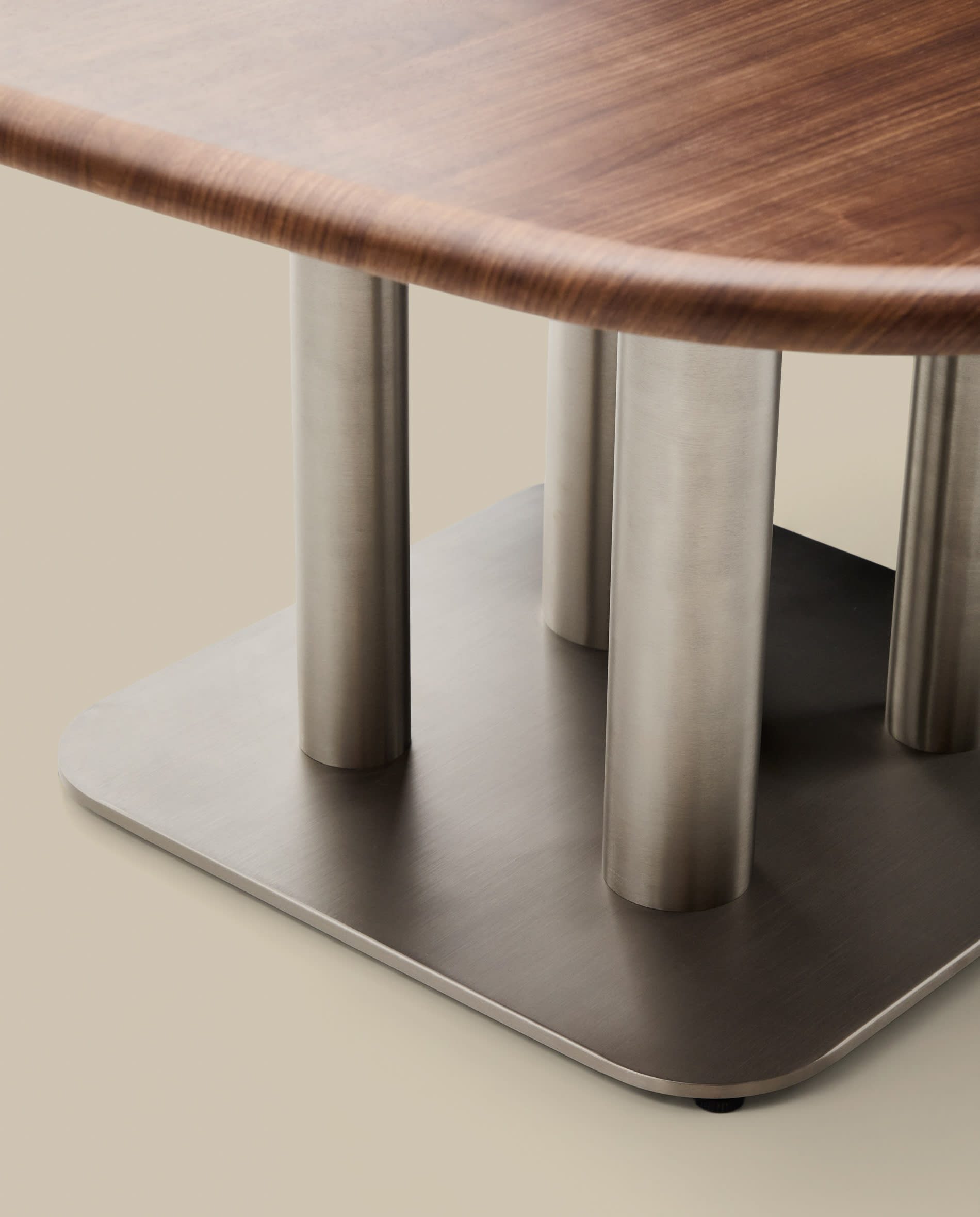Melvar table made from walnut veneer and legs with brushed stainless steel base 150 x 150cm