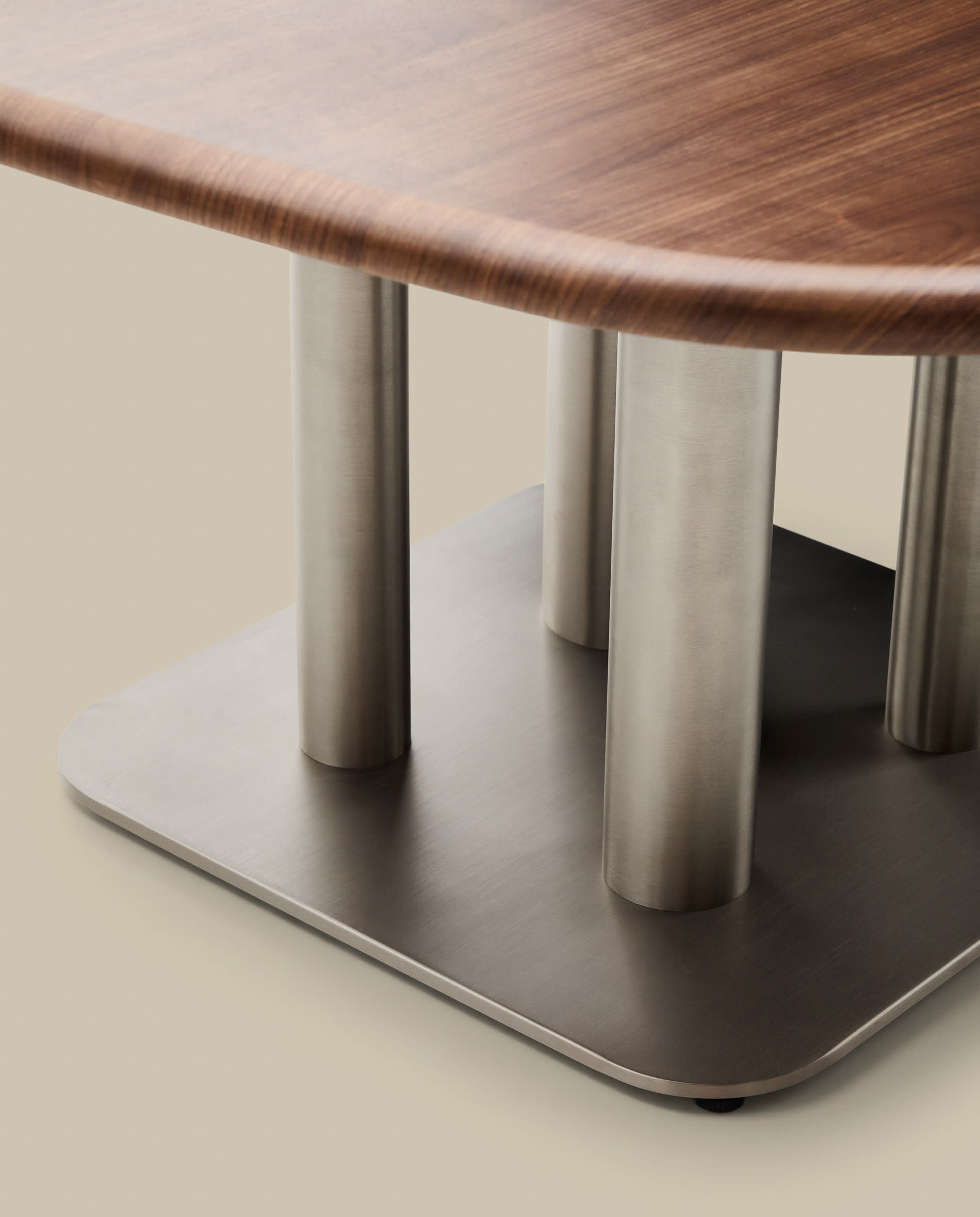 Melvar table made from walnut veneer and legs with brushed stainless steel base 121 x 121cm