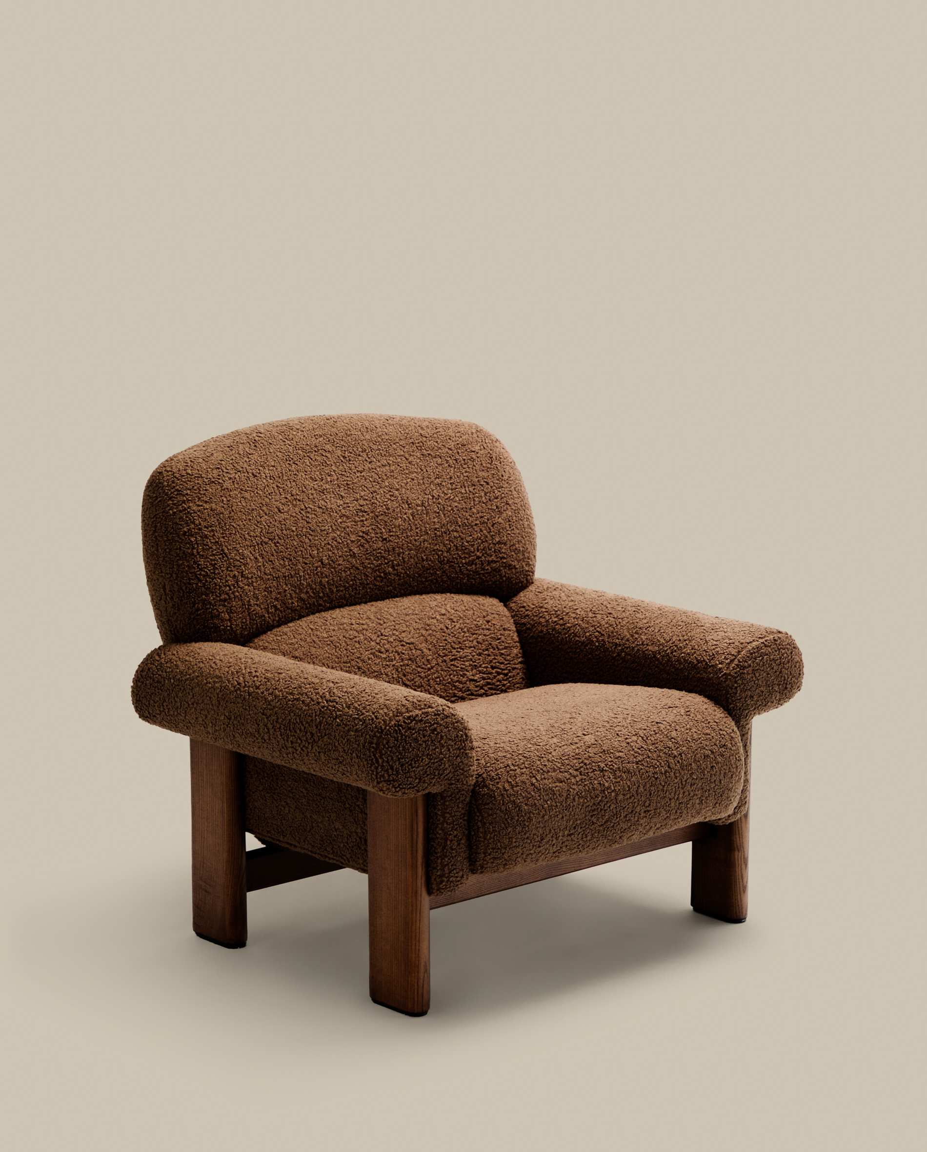 Nema armchair in taupe bouclé with solid ash wood legs in a walnut finish FSC 100%