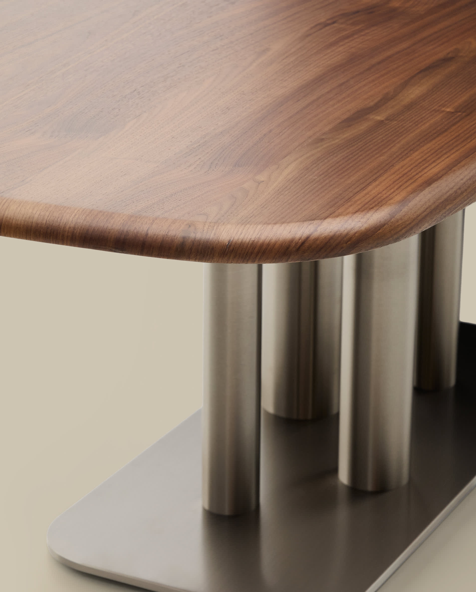 Melvar table made from walnut veneer and legs with brushed stainless steel base 180 x 100cm