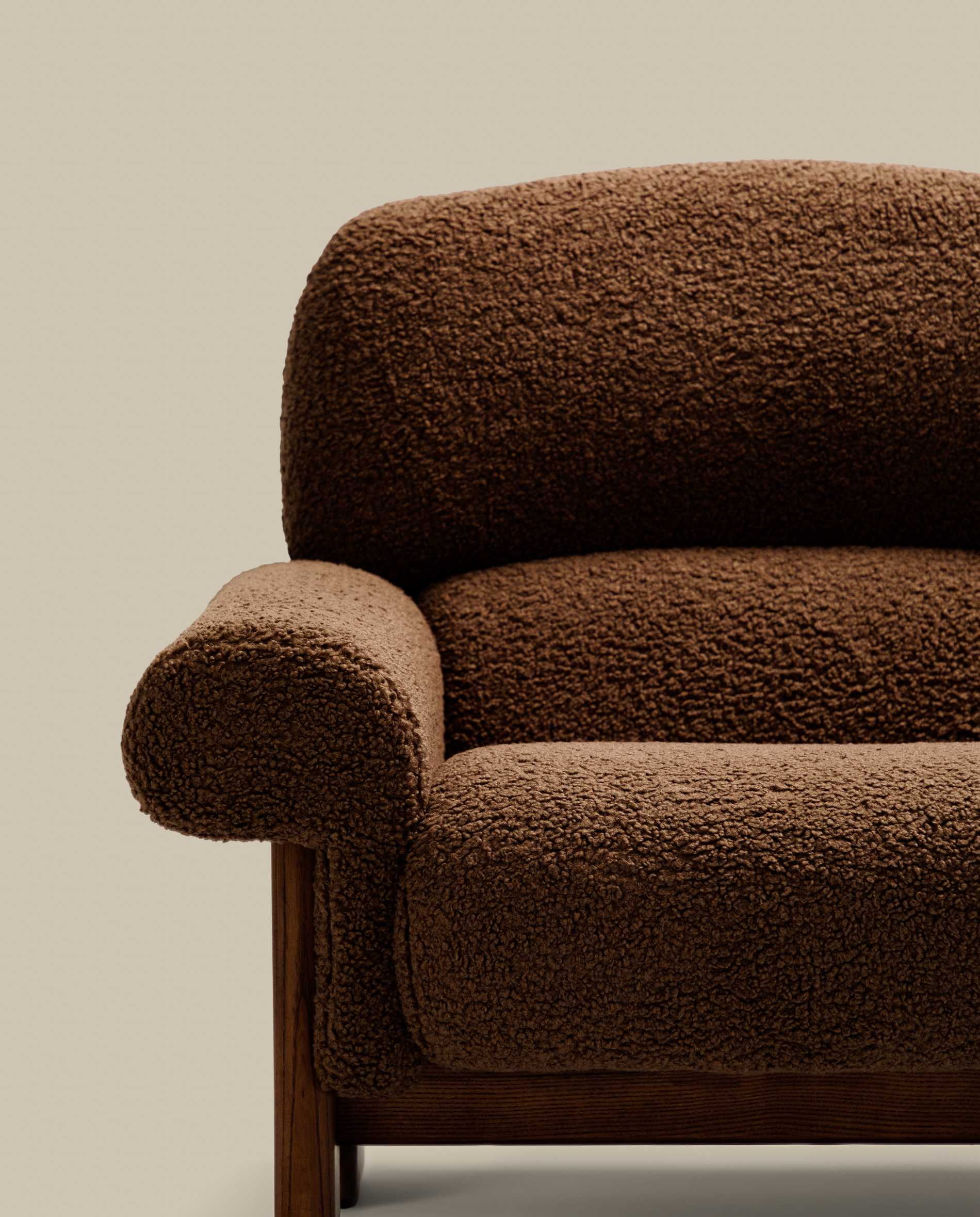 Nema armchair in taupe bouclé with solid ash wood legs in a walnut finish FSC 100%