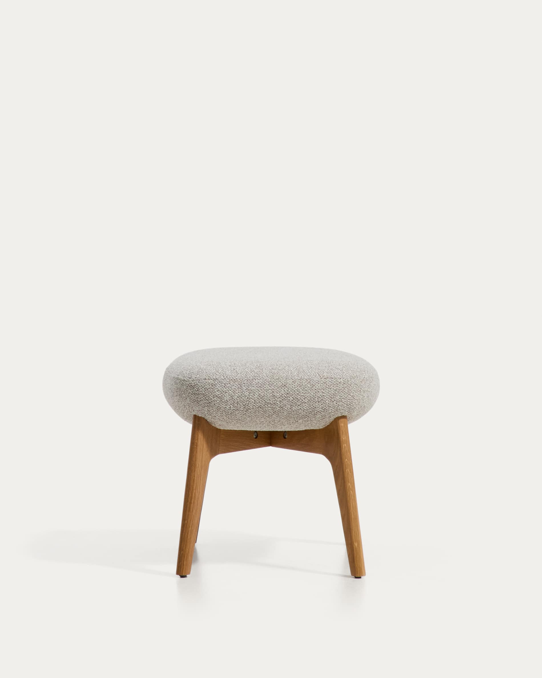 Adiran footrest in beige thick chenille with solid oak wood legs with a natural finish