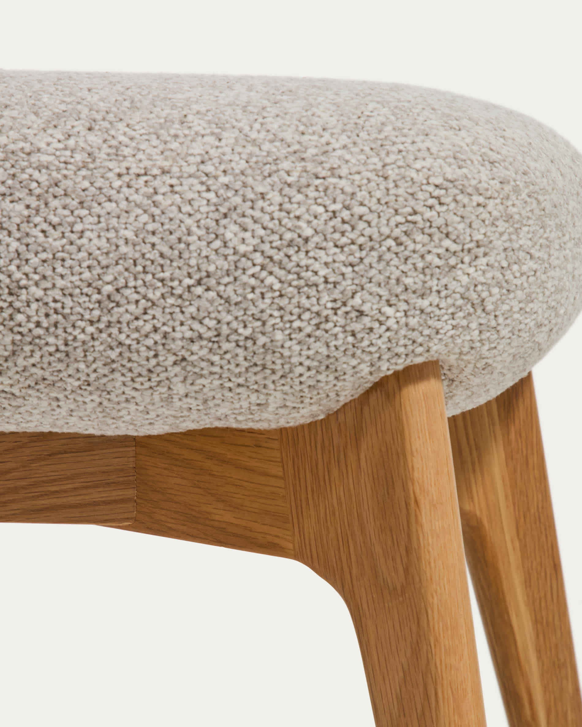 Adiran footrest in beige thick chenille with solid oak wood legs with a natural finish