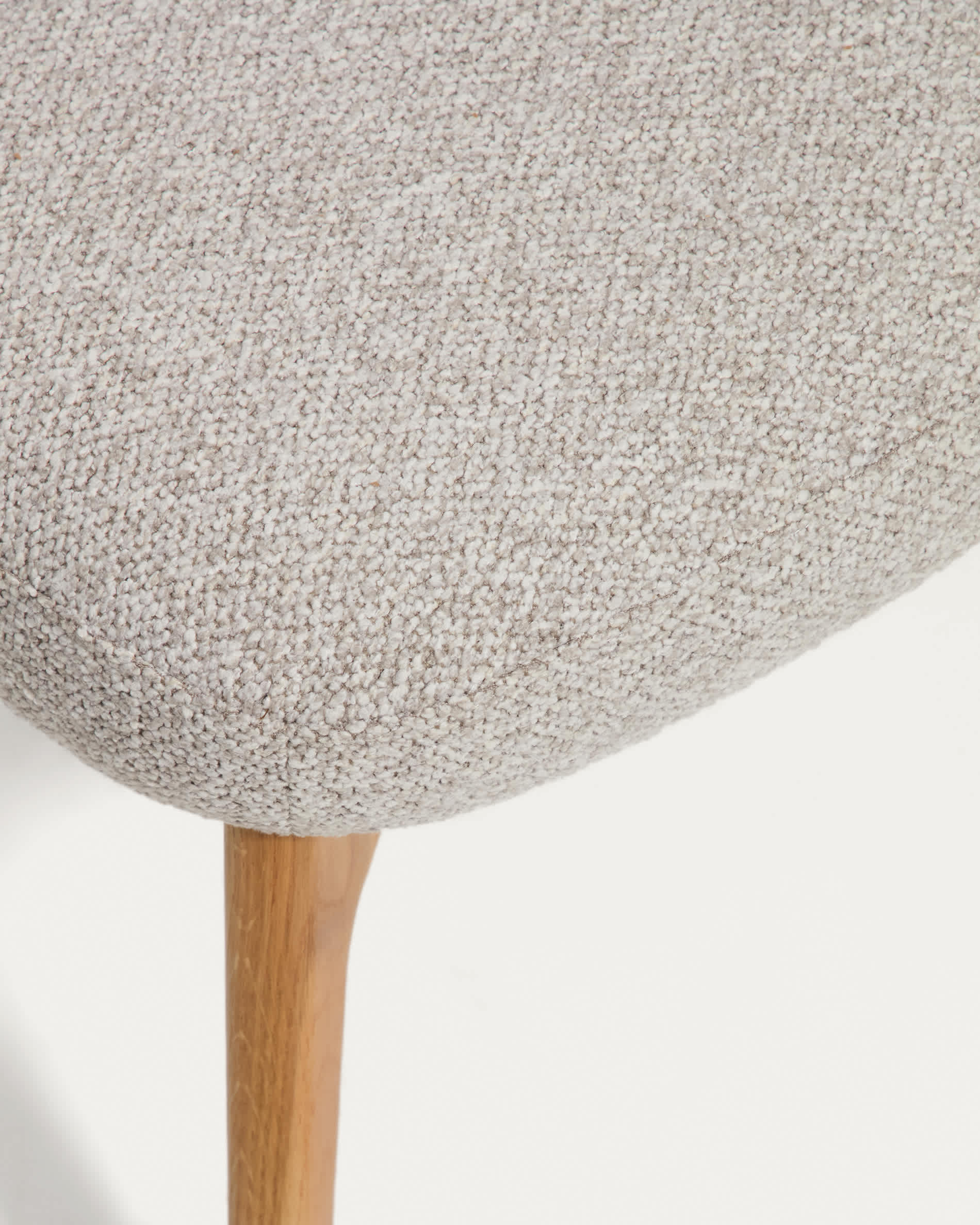Adiran footrest in beige thick chenille with solid oak wood legs with a natural finish