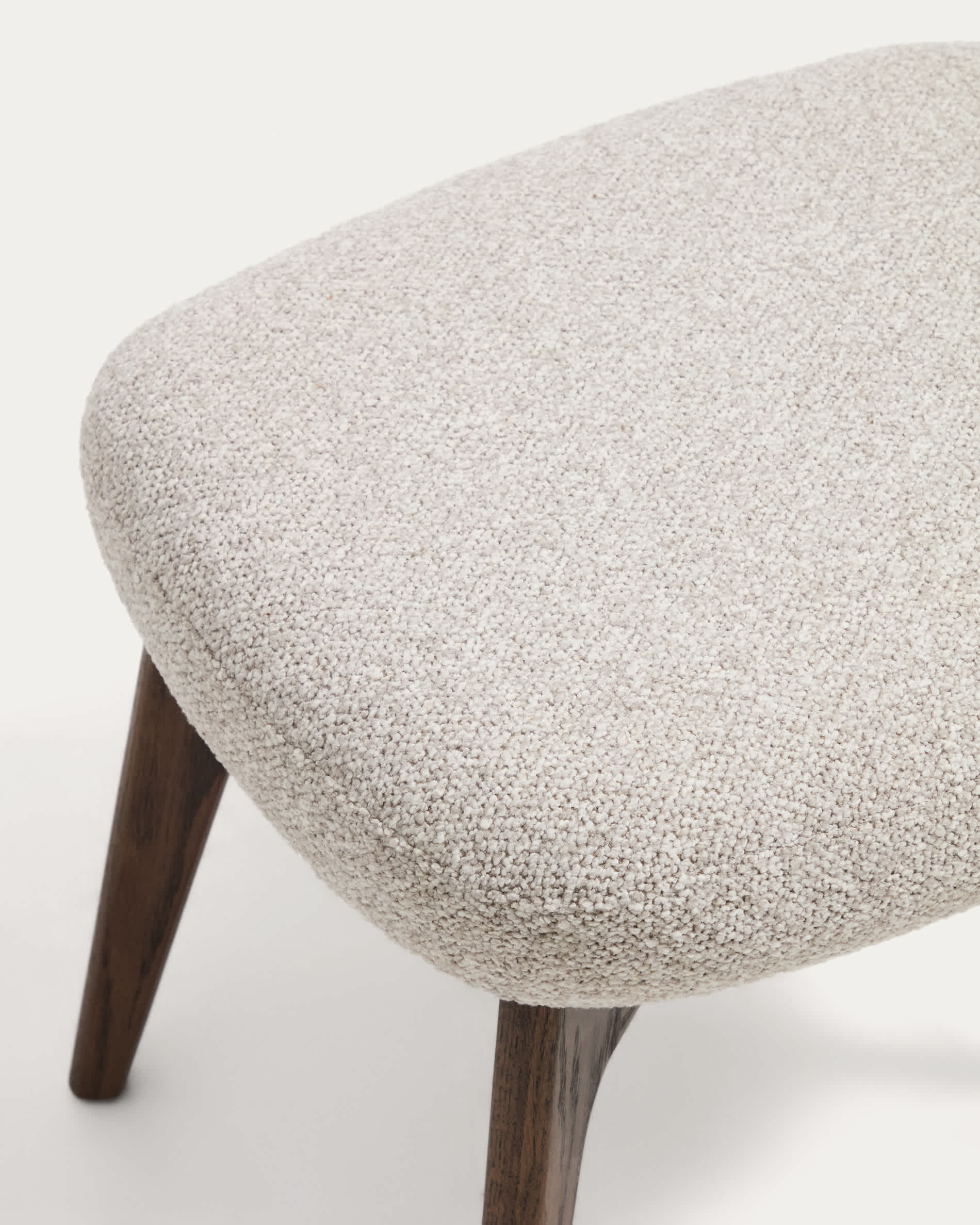 Adiran footrest in beige thick chenille with solid oak wood legs with a walnut finish