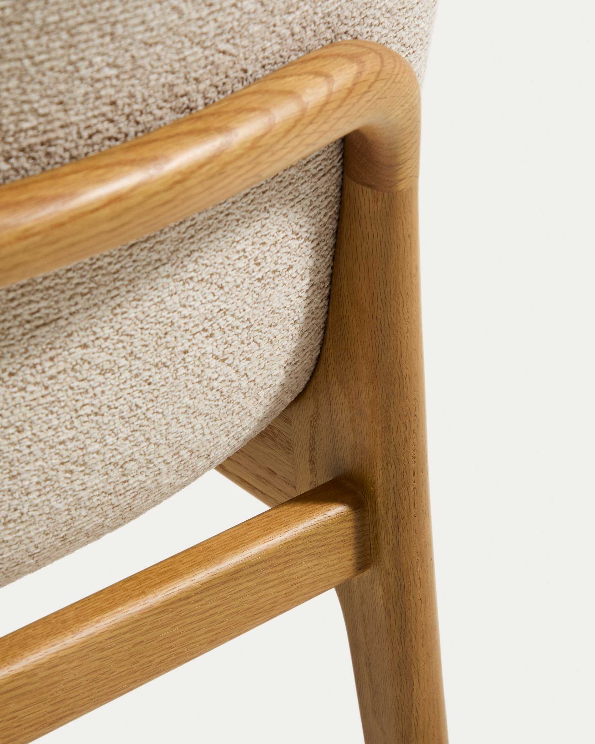 Elnor chair with armrests in beige chenille with solid oak wood legs in a natural finish