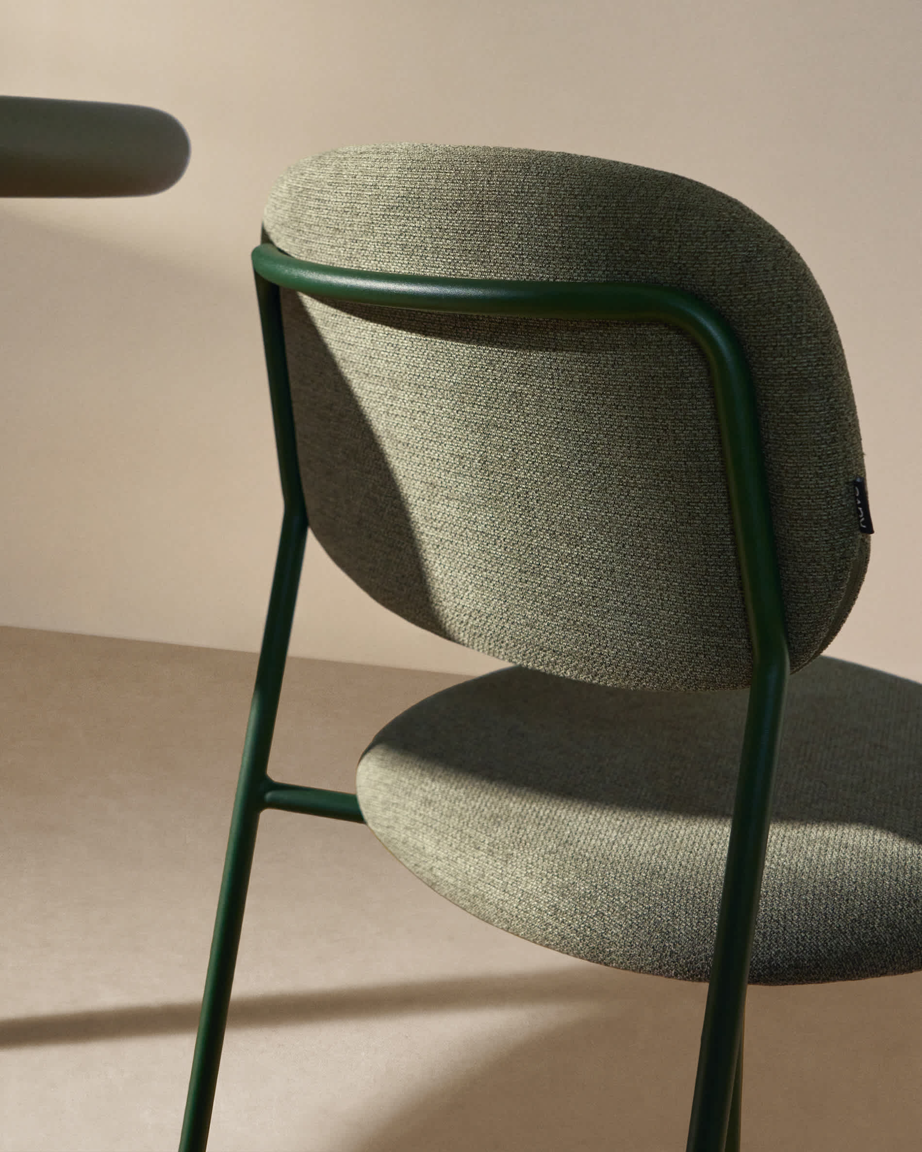 Meli stackable chair in green chenille with green metal legs FSC Mix Credit