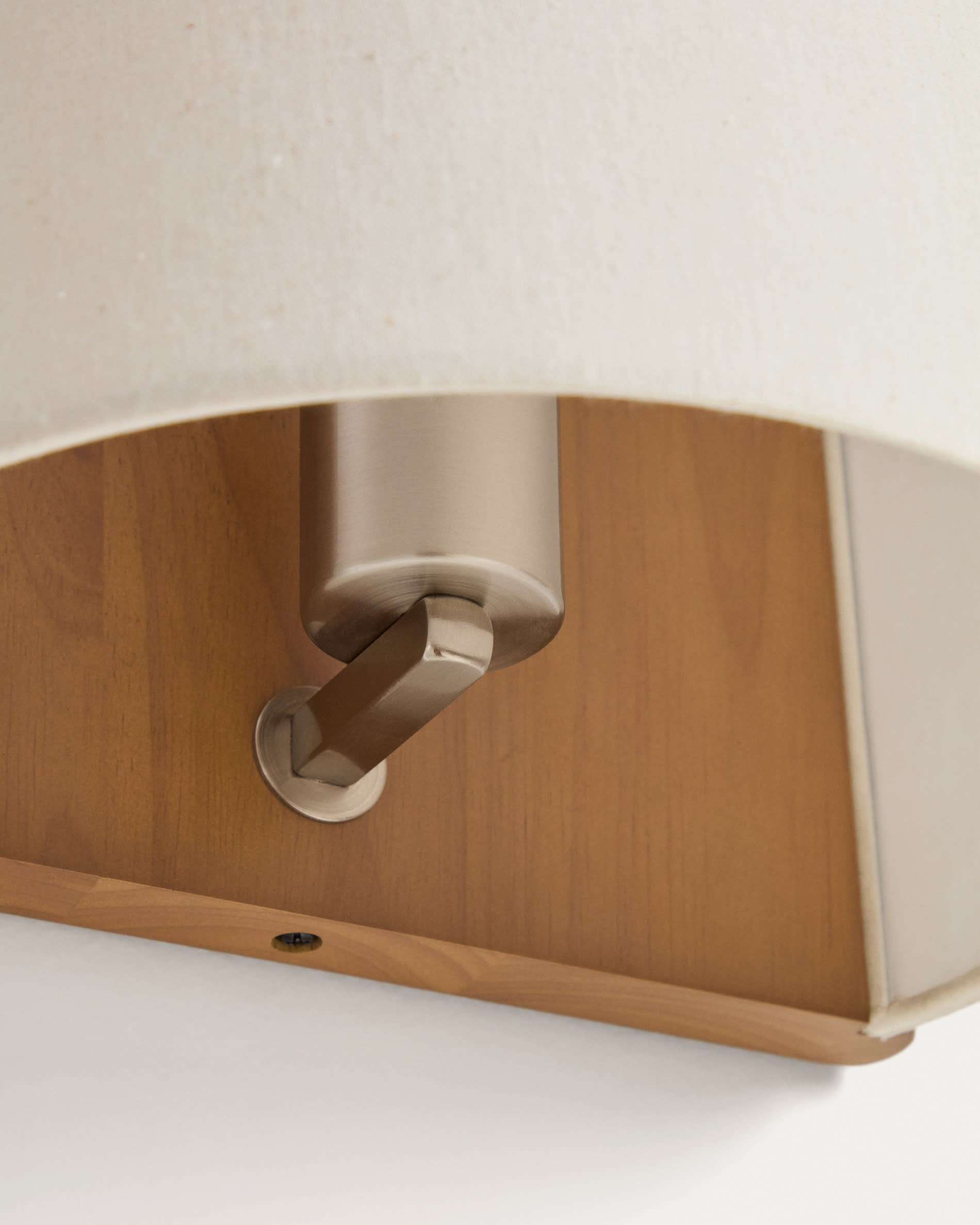 Umbran wall-mounted light fixture made from light brown rubberwood and beige linen