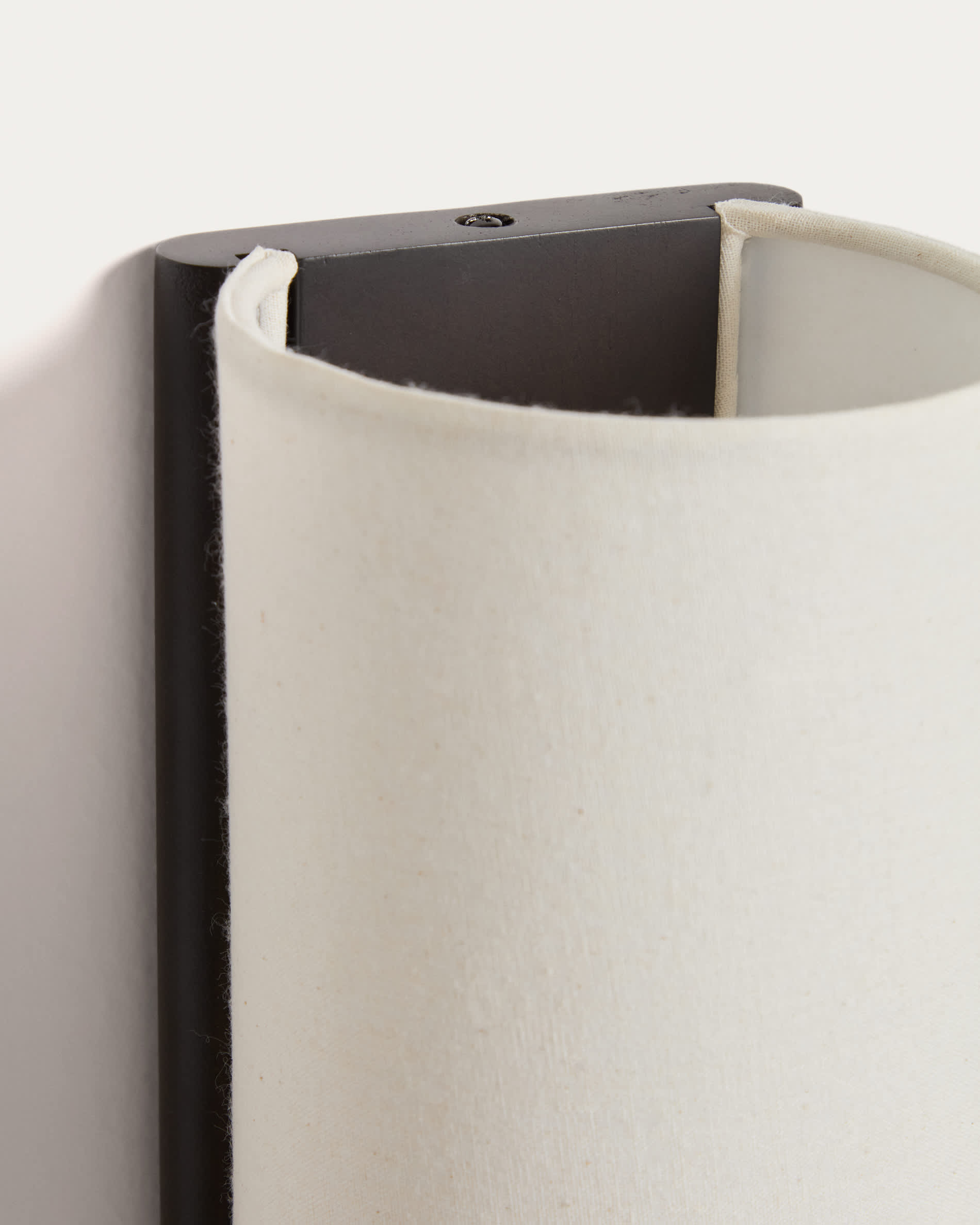 Umbran wall-mounted light fixture in dark brown rubberwood and beige linen