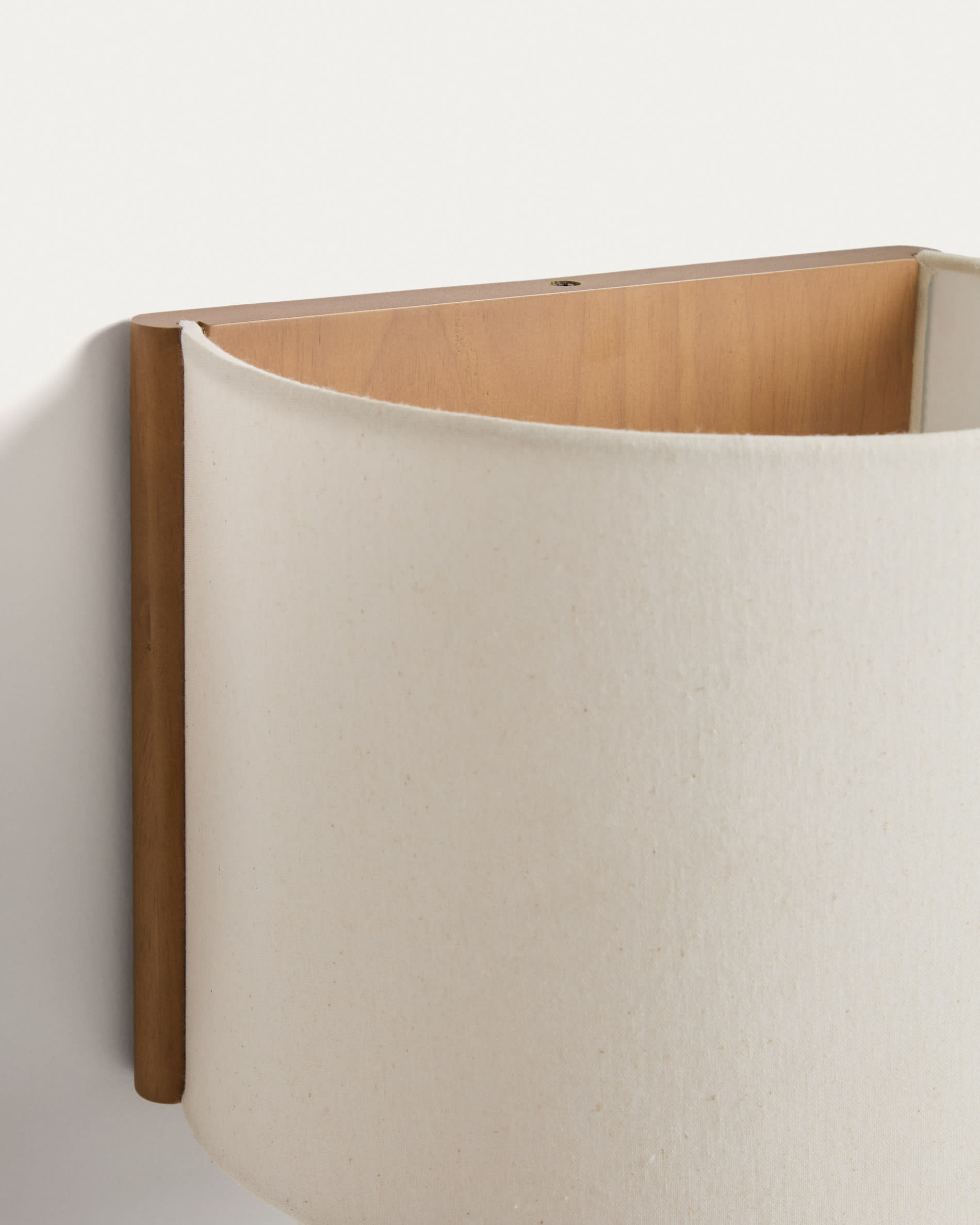 Umbran wall-mounted light fixture made from light brown rubberwood and beige linen