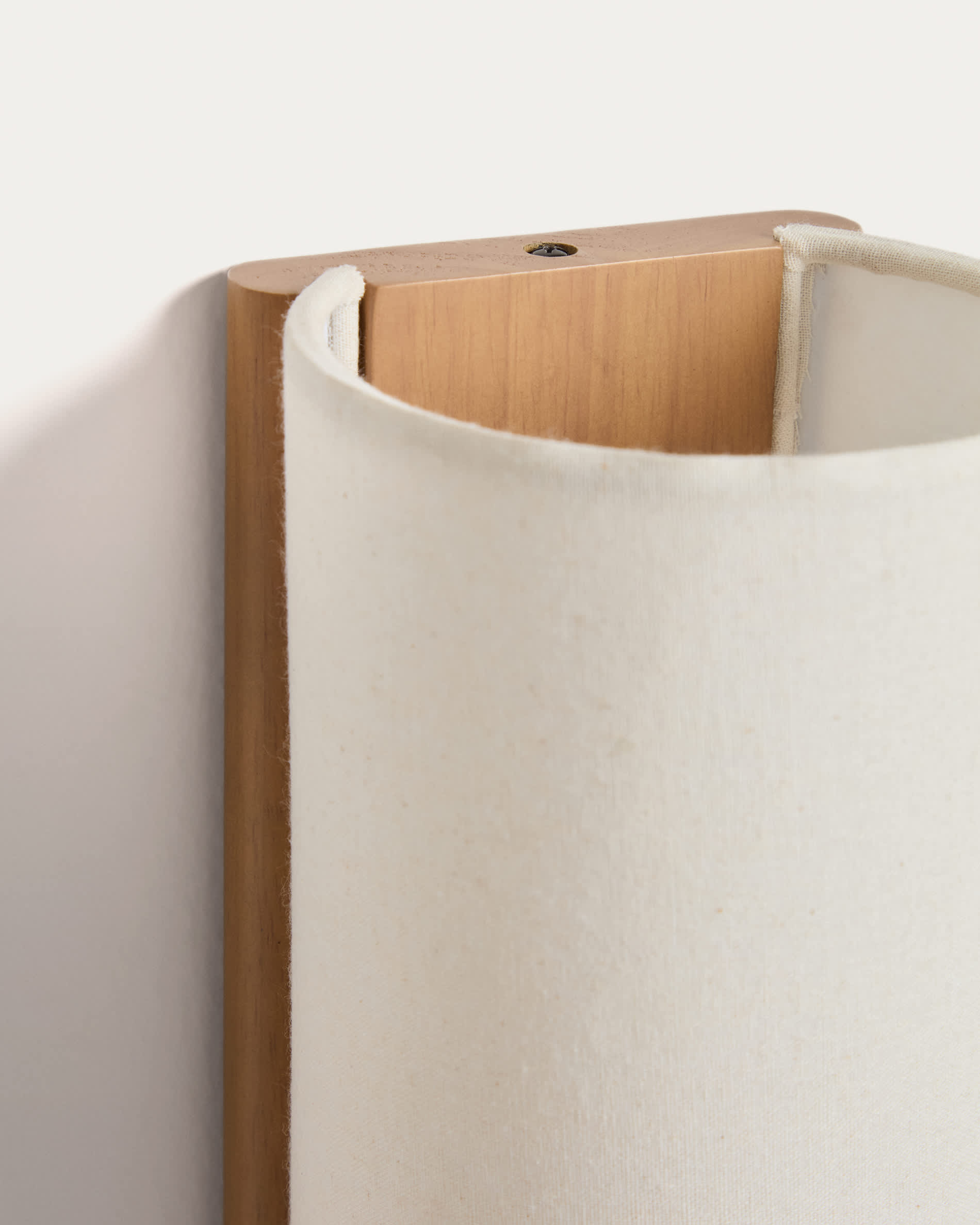 Umbran wall-mounted light fixture made from light brown rubberwood and beige linen