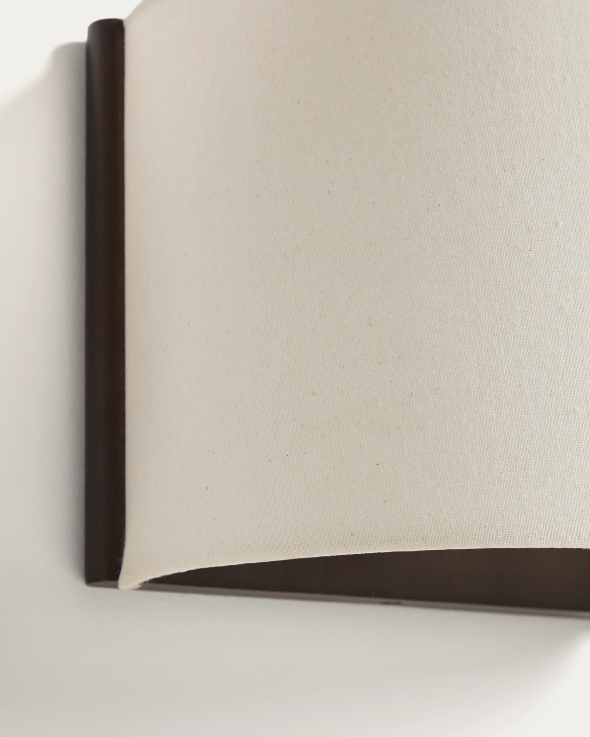 Umbran wall-mounted light fixture in dark brown rubberwood and beige linen