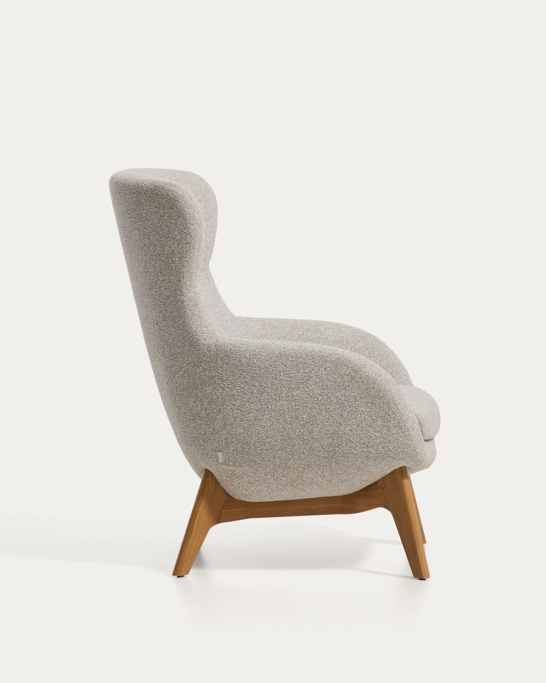 Adiran armchair in beige thick chenille with solid oak wood legs with a natural finish