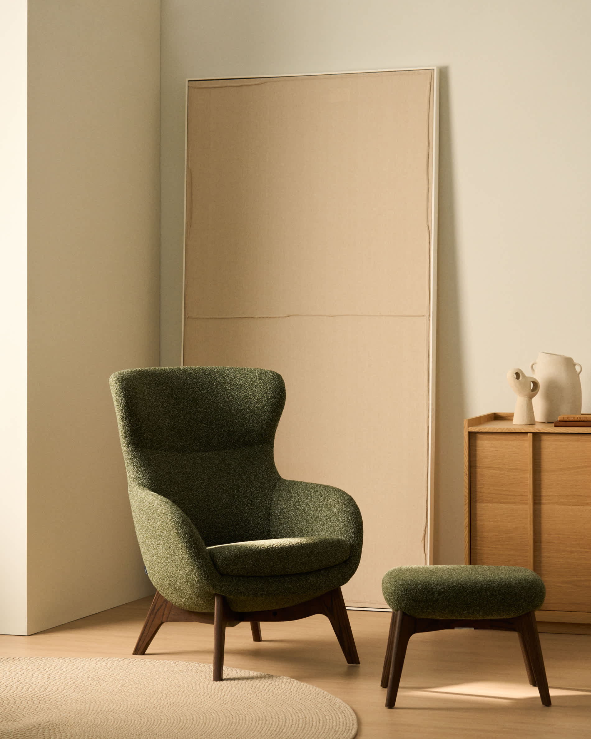 Adiran footrest in moss green thick chenille with solid oak wood legs with a walnut finish