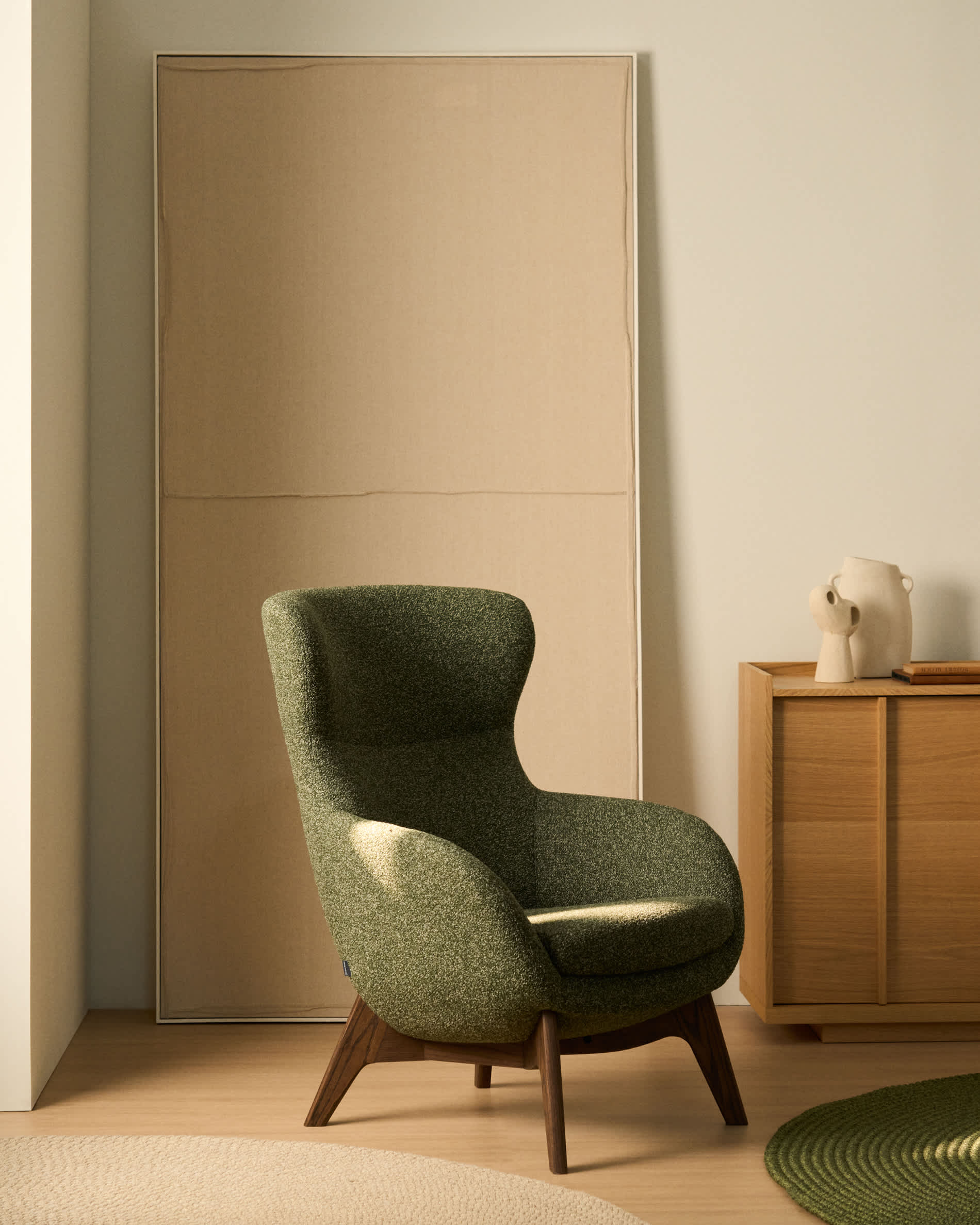 Adiran footrest in moss green thick chenille with solid oak wood legs with a walnut finish