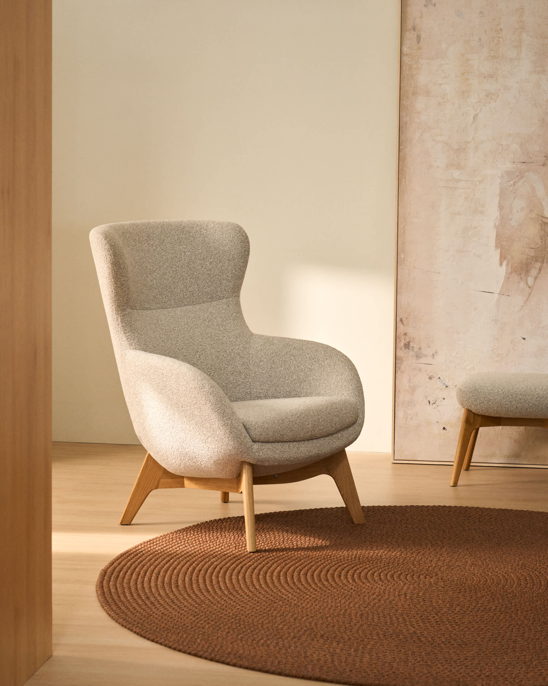 Adiran armchair in beige thick chenille with solid oak wood legs with a natural finish