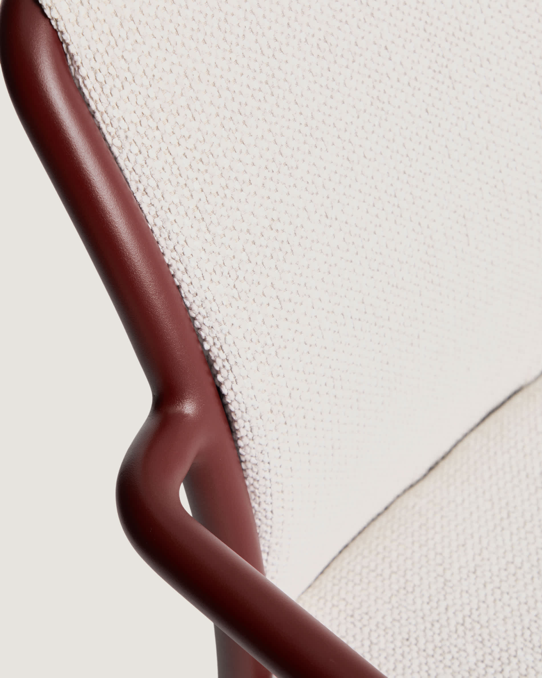 Linosa stackable outdoor chair in burgundy aluminium with beige cushion