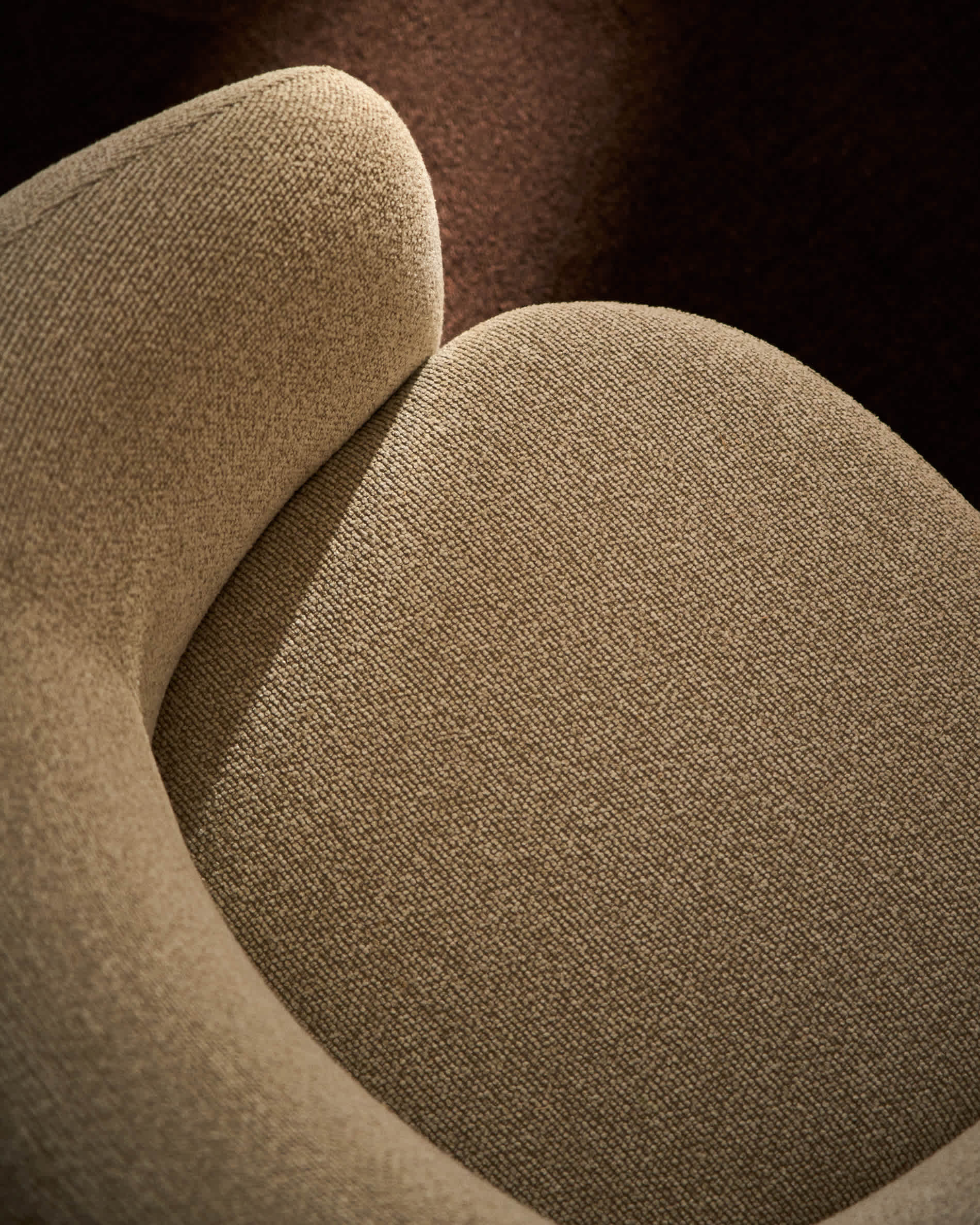 Odenia swivel armchair in beige micro bouclé