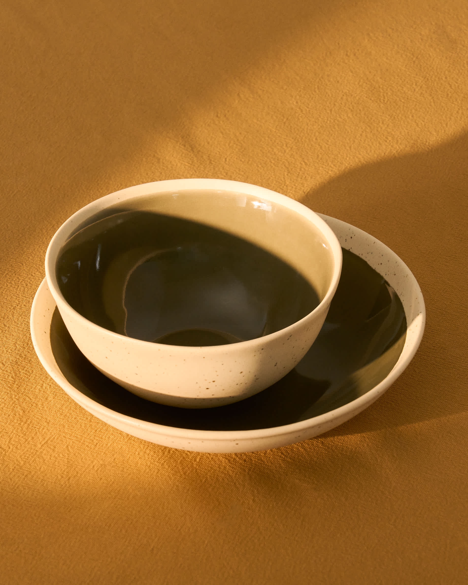 Nale beige ceramic soup bowl with green bottom