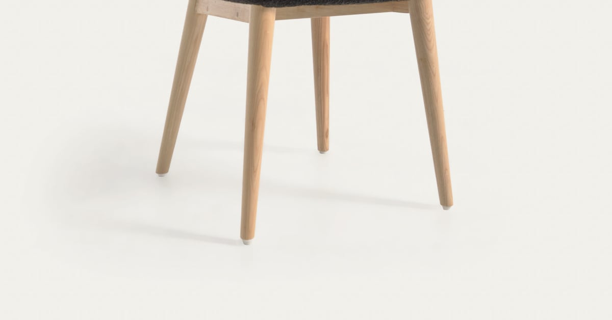 Sample Chair Konna chair in black bouclé with solid ash wood legs in a natural ...