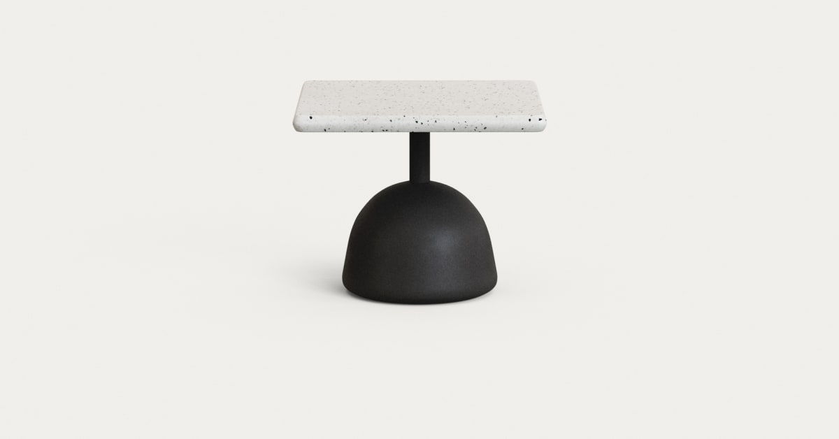 Saura coffee table with white terrazzo top and black cement base