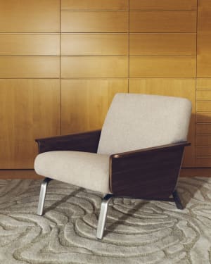 Amsen light brown armchair in walnut plywood with legs in brushed stainless steel FSC 100%