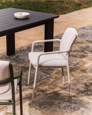 Linosa stackable chair in natural aluminium with beige cushion