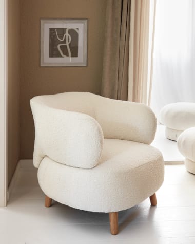 Luisa white bouclé armchair with solid rubber wood legs.