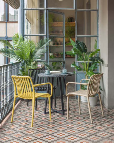 Tella round terrazzo table in black with steel legs, Ø 70 cm