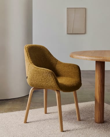 Aleli chair in mustard bouclé with solid ash wood legs and natural finish