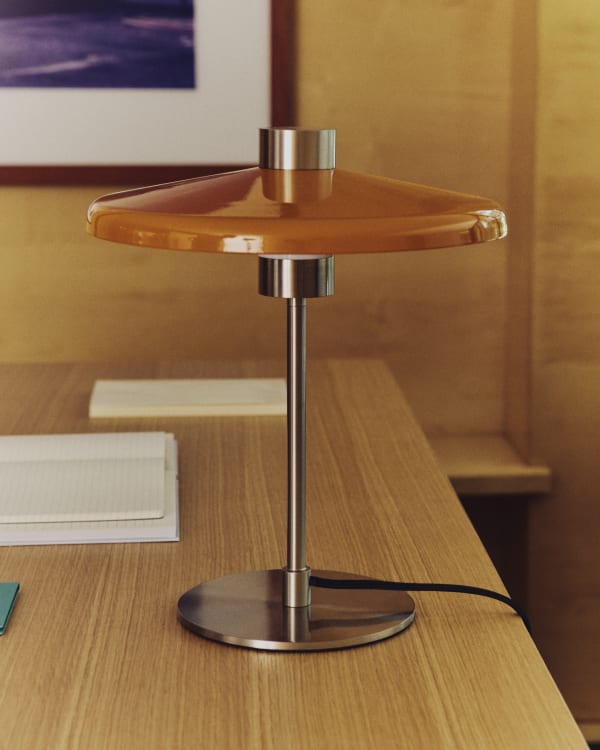 Nuvira table lamp in light grey brushed metal and orange lampshade